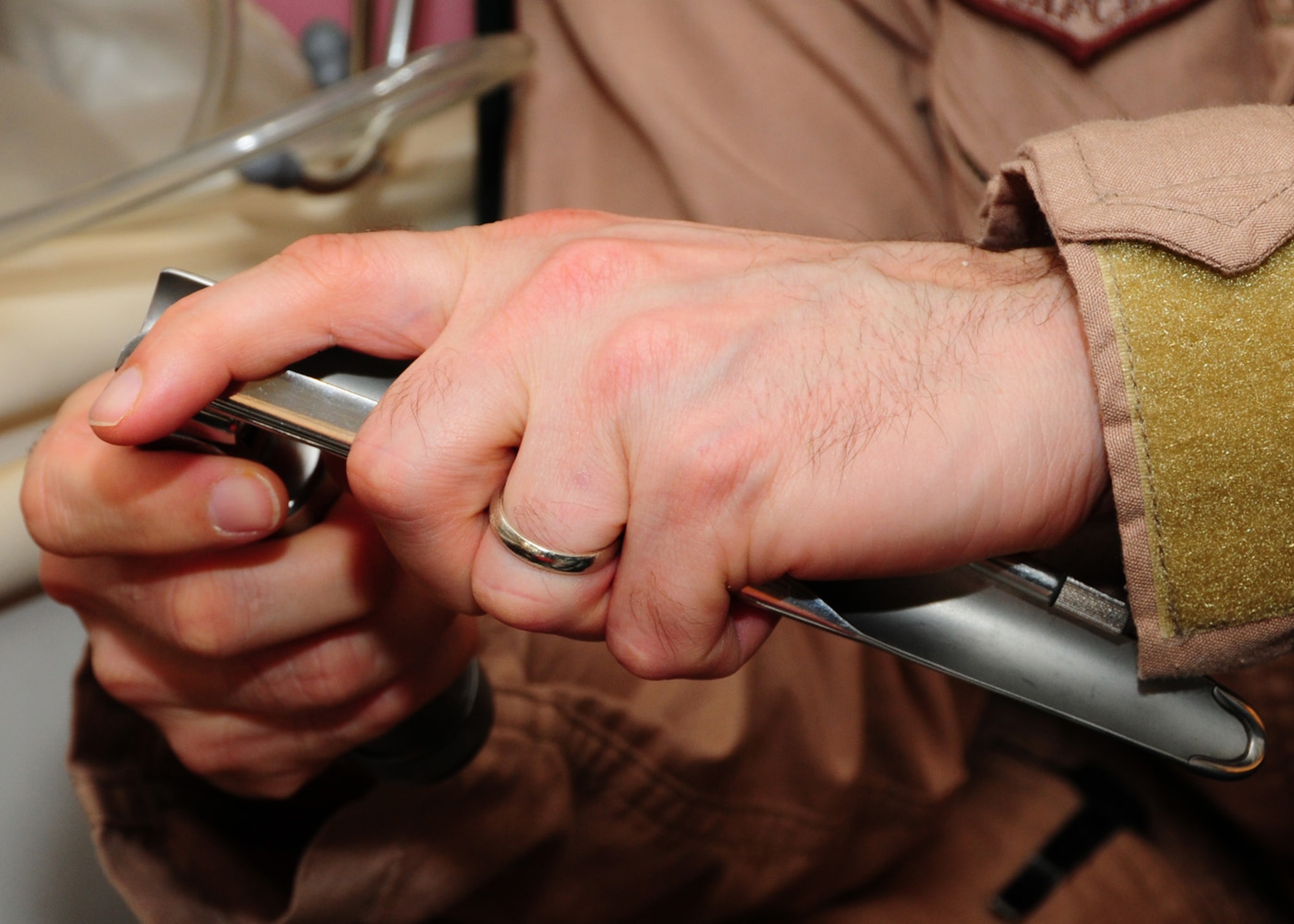 SOUTHWEST ASIA -- Capt. Charles Bevan, 737th Expeditionary Airlift Squadron medical element, attaches a miller blade to a laryngoscope handle to check for adequate battery lighting power at an air base in Southwest Asia, May 26. This is used to provide a visual pathway into the trachea so an endotracheal tube can be properly placed to assist with the mechanical ventilation of a patient. Captain Bevan is currently deployed from Dyess Air Force Base, Texas, and is originally from Salisbury, Conn. (U.S. Air Force photo/ Senior Airman Courtney Richardson)