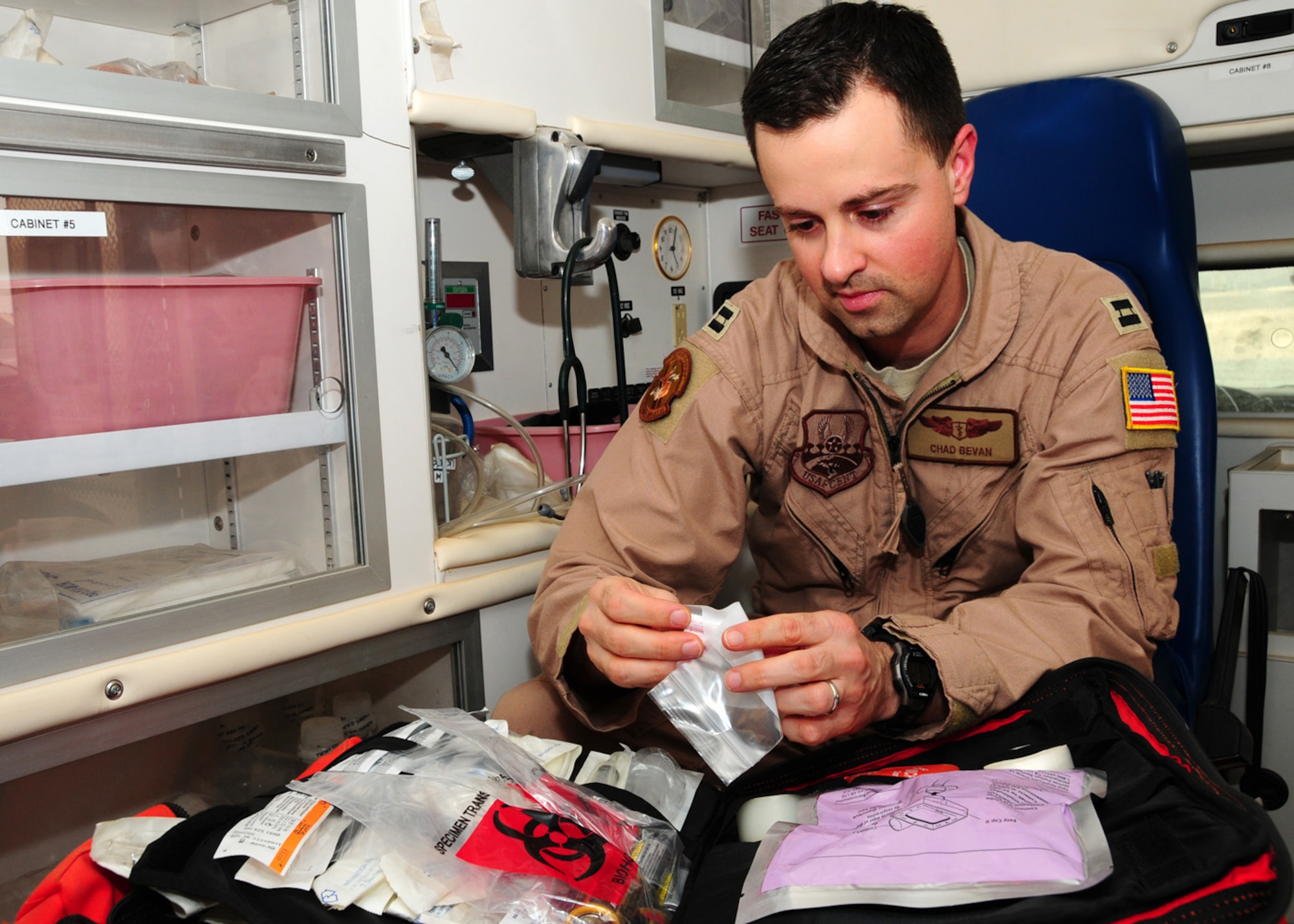 SOUTHWEST ASIA -- Capt. Charles Bevan, 737th Expeditionary Airlift Squadron medical element, checks the expiration date on a benzoin tincture applicator at an air base in Southwest Asia, May 26. The applicators are used as an adhesive to assist in securing endotracheal tubes in intubated patients to ensure the tube does not fall out. Captain Bevan is currently deployed from Dyess Air Force Base, Texas, and is originally from Salisbury, Conn. (U.S. Air Force photo/ Senior Airman Courtney Richardson)