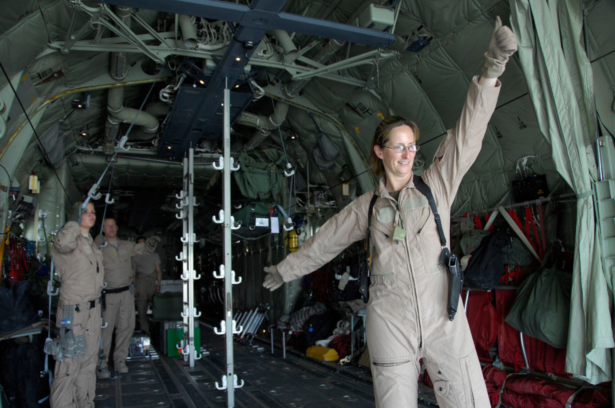 KANDAHAR AIR FIELD, Afghanistan - Maj. Melissa Steckler, a nurse with the 451st Expeditionary Aeromedical Evacuation Flight, clears the ground team to load medical equipment and supplies onto a C-130J here on May 22. The 451st EAEF mission is to facilitate and execute fixed-wing patient movement within the Afghanistan theater of operations. (U.S. Air Force photo by 1st Lt. Noelle Caldwell)