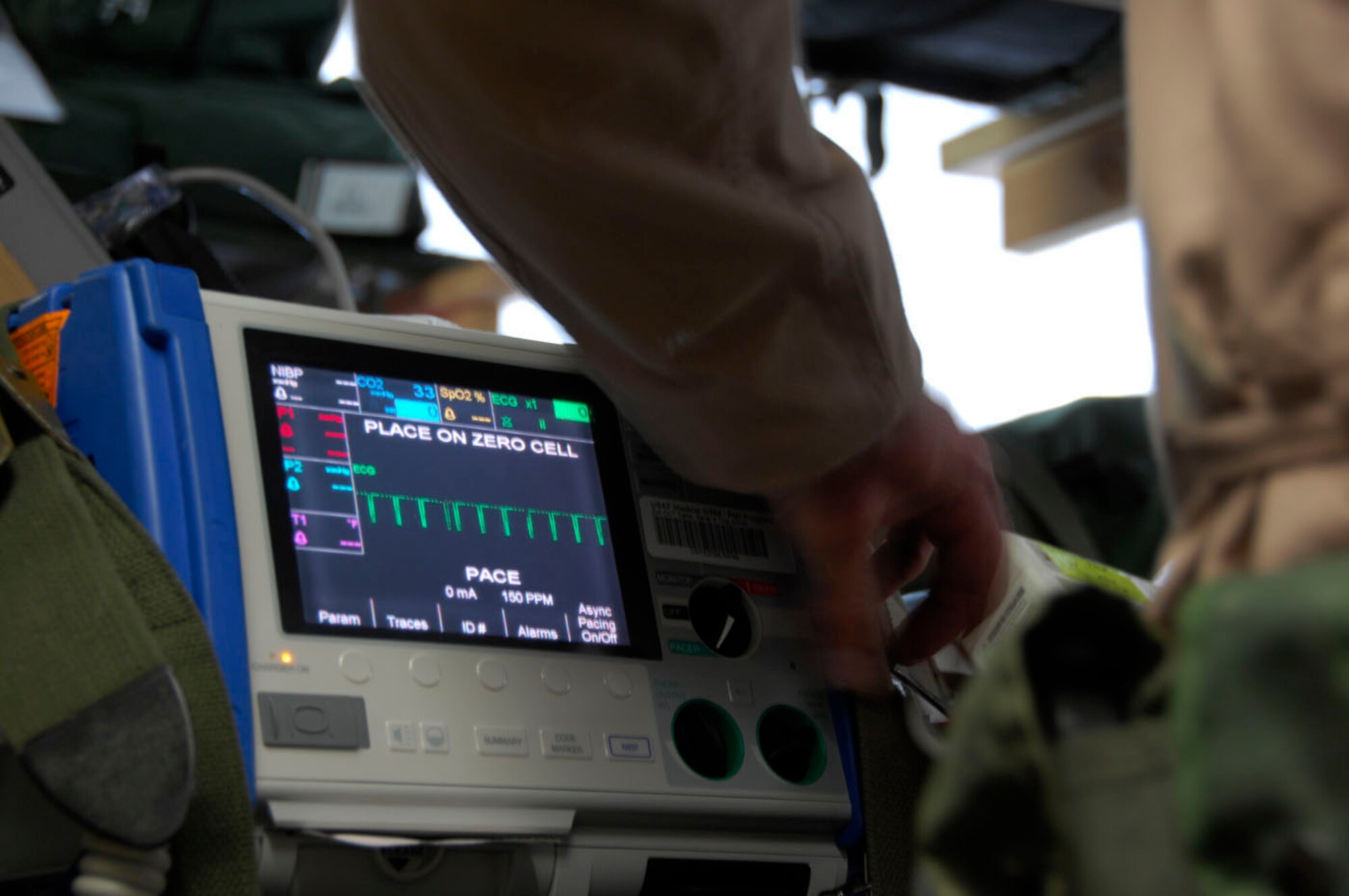 Two 451st Expeditionary Aeromedical Evacuation Flight medical technicians test medical equipment for their first mission on May 22. The 451st EAEF mission is to facilitate and execute fixed-wing patient movement within the Afghanistan theater of operations. (U.S. Air Force photo by 1st Lt. Noelle Caldwell) 
