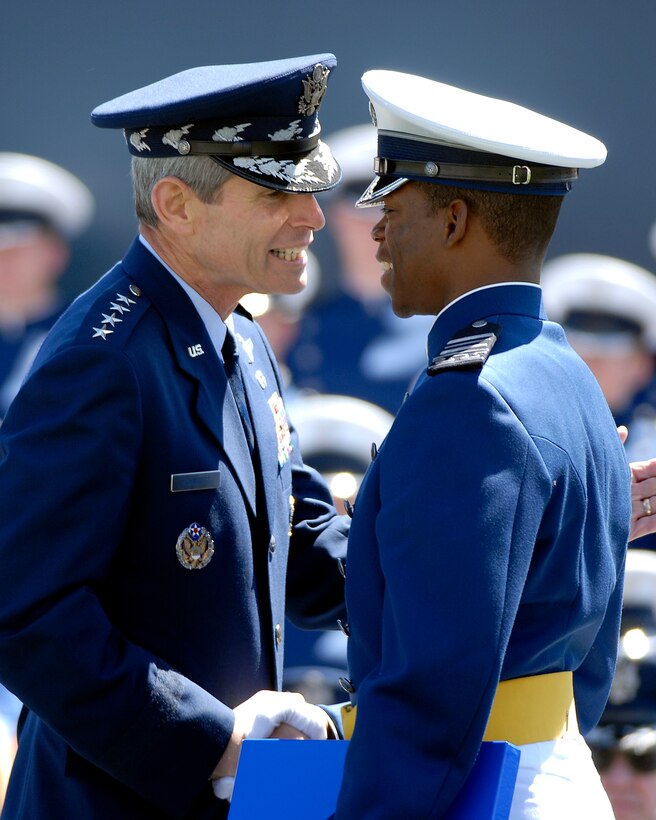 U.S. Air Force Chief of Staff Gen. Norton Schwartz congratulates newly commissioned 2nd Lt. Kellen Curry during the U.S. Air Force Academy Class of 2009 graduation ceremony at Falcon Stadium on the U.S. Air Force Academy campus in Colorado Springs, Colo., May 27, 2009.
