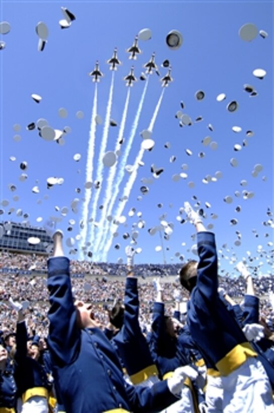 The 1,046 newly commissioned second lieutenants at the U.S. Air Force Academy commemorate their achievement by tossing their hats as the Air Force Thunderbirds fly over Falcon Stadium on the U.S. Air Force Academy campus in Colorado Springs, Colo., May 27, 2009.