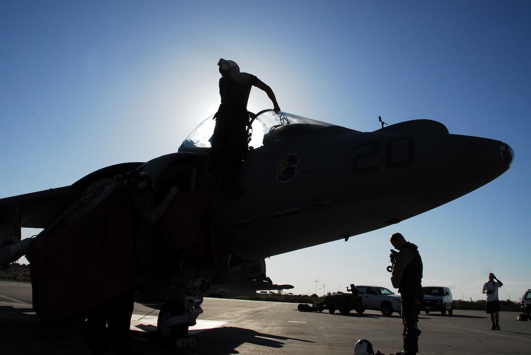 Cpl. Michael Hinson, Marine Attack Training Squadron 203 powerlines technician, makes preflight adjustments to a TAV-8B Harrier on the flight line at the Marine Corps Air Station in Yuma, Ariz., May 29, 2009. The squadron arrived in Yuma May 5, 2009, and will complete their training schedule and depart June 6, 2009.