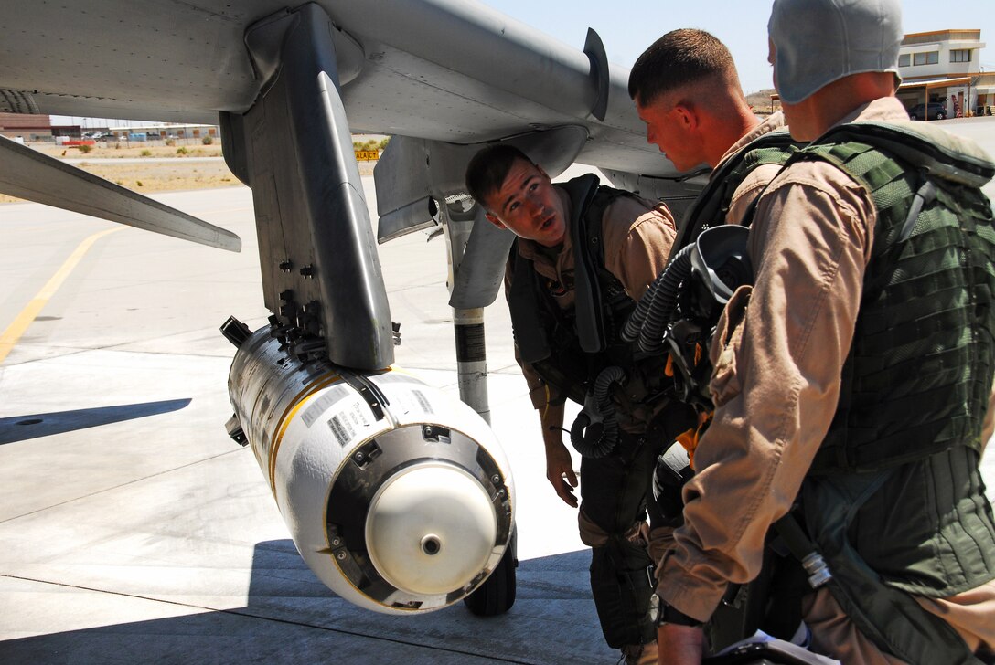 Capt. Kyle Buchina, Marine Attack Training Squadron 203 instructor, speaks to students May 28, 2009, about the CBU-99 cluster bombs the students will use in their upcoming flight at the Marine Corps Air Station in Yuma, Ariz. While visiting Yuma, VMAT-203 student pilots participate in a number of live-fire exercises designed to sharpen their air-to-ground bombing skills, on Yuma’s ranges.