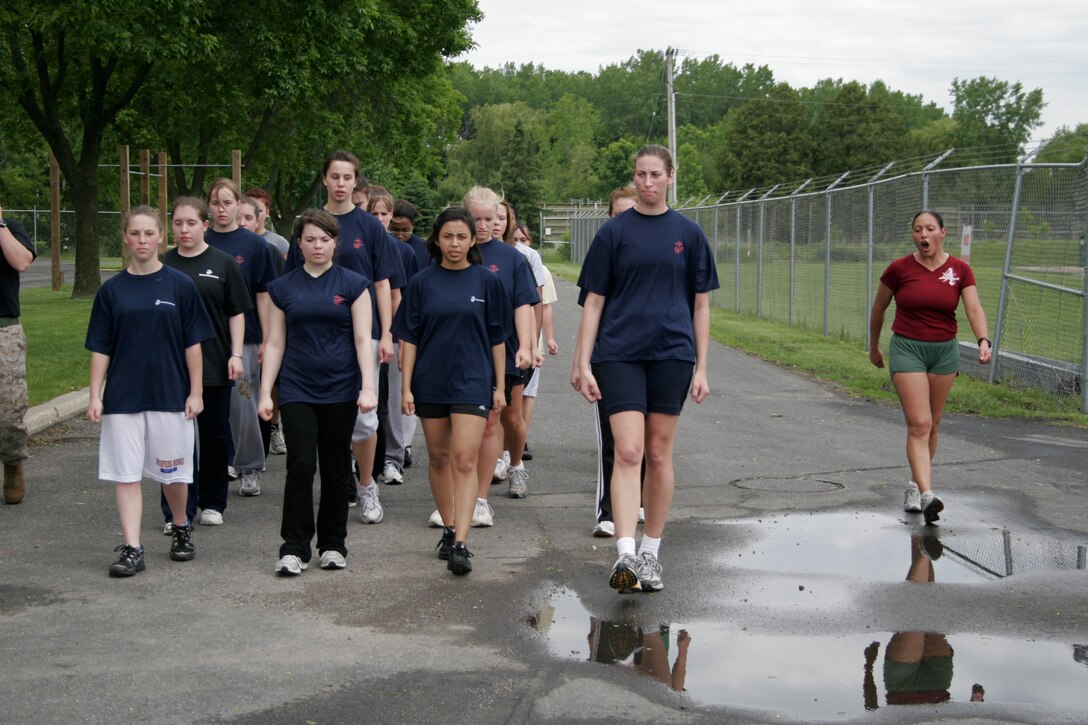 Recruiting Station Milwaukee poolees are marched by Drill Instructor Sgt. Maria Arellano after performing an initial strength test during a female pool function March 30 at the U.S. Marine Corps Reserve Center in Madison, Wis. RS Milwaukee recruiters hope a new focus on female-only functions will lower its female pool attrition rate, which is currently at 26 percent. Arellano is a drill instructor at Marine Corps Recruit Depot Parris Island, S.C.