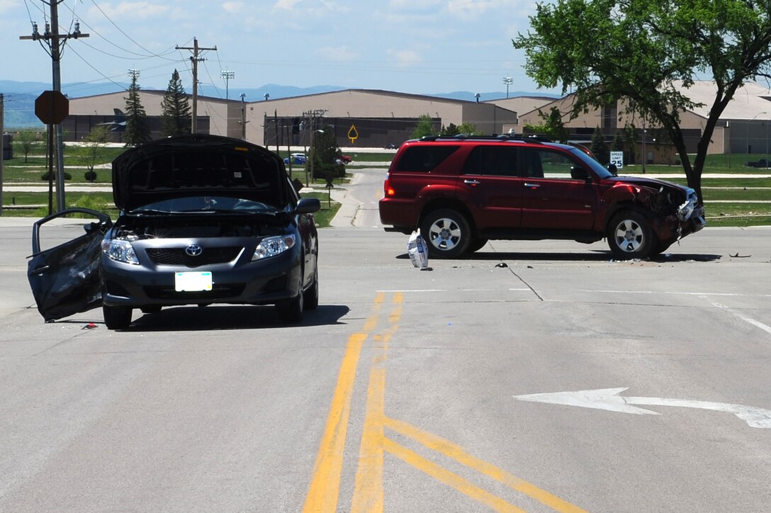 Members of the 28th Security Forces Squadron responded to an accident at the intersection of Ellsworth Street and Spaatz Drive here, May 27. The 28th Bomb Wing ground safety office reminds Ellsworth drivers to be cautious of distractions while driving. The accident is currently under investigation. (U.S. Air Force photo/Senior Airman Kasey Zickmund)