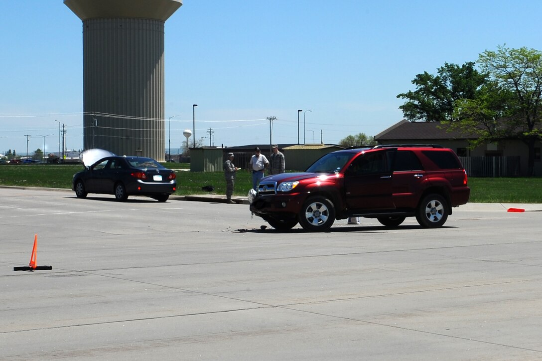 Members of the 28th Security Forces Squadron responded to an accident at the intersection of Ellsworth Street and Spaatz Drive here, May 27. The 28th Bomb Wing ground safety office reminds Ellsworth drivers to be cautious of distractions while driving. The accident is currently under investigation. (U.S. Air Force photo/Senior Airman Kasey Zickmund)