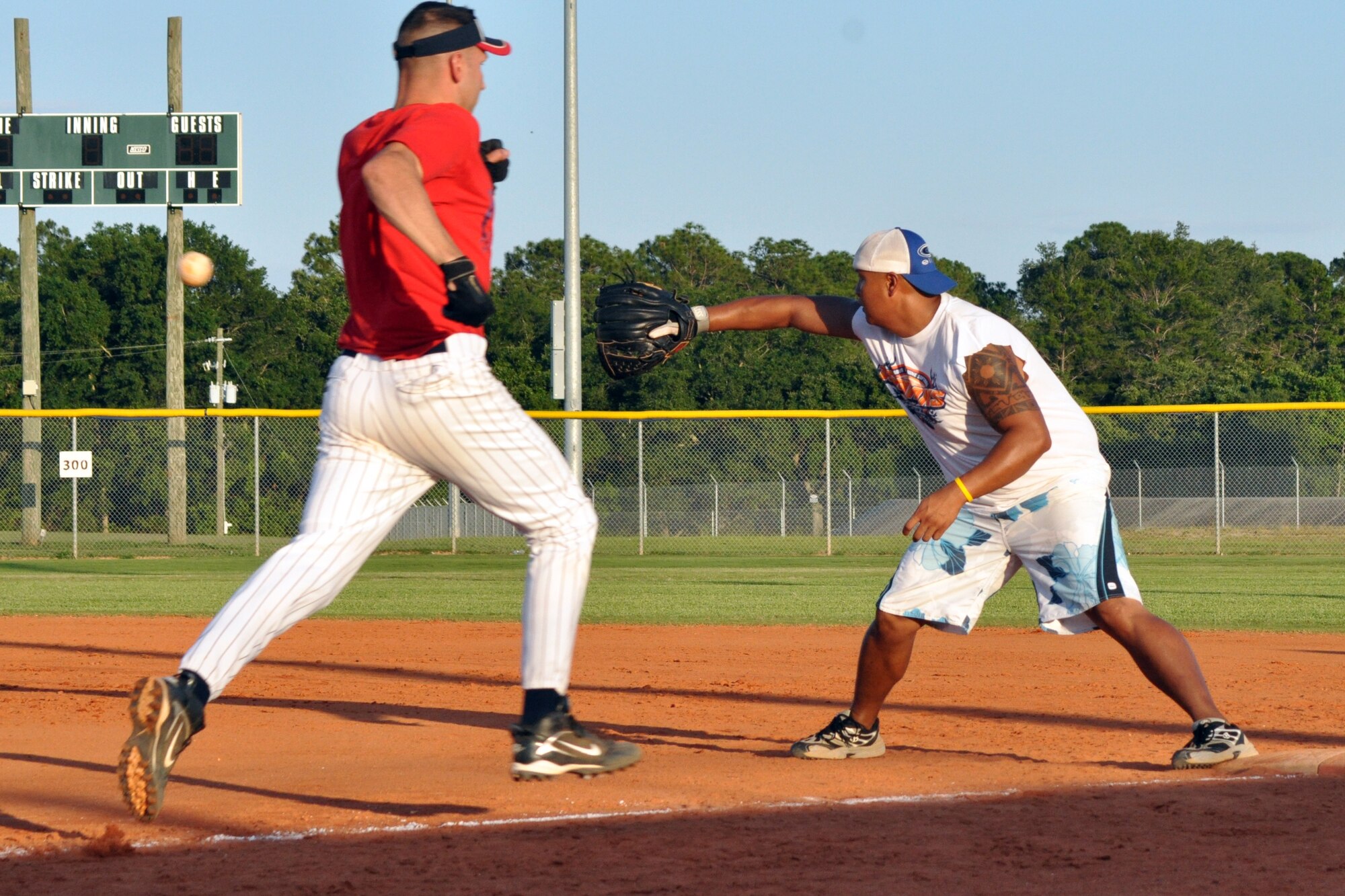 EGLIN AIR FORCE BASE, Fla. – Master Sgt. Darren Dunham, a player for the 96th Force Support Squadron, races to beat the throw to first base during an American League intramural softball game, May 27.  The 1st Special Operations Maintenance Squadron shellacked the 96th FSS, 15-2. (U.S. Air Force photo/ Airman Anthony Jennings)