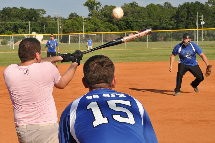 EGLIN AIR FORCE BASE, Fla. – A player from the 96th Medical Group swings at a high pitch from the 96th Security Forces Squadron Knights pitcher during an American League intramural softball game, May 27. The Knights held off the 96th Med Group, 11-9. (U.S. Air Force photo/ Airman Anthony Jennings)