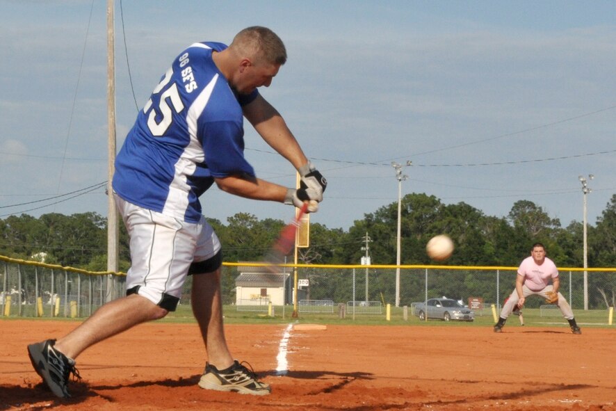 EGLIN AIR FORCE BASE, Fla. – Senior Airman Sandor Bocsi, 96th Security Forces Squadron Knights team member, swings away during an American League intramural softball game, May 27. The Knights held off the 96th Med Group, 11-9. (U.S. Air Force photo/ Airman Anthony Jennings)