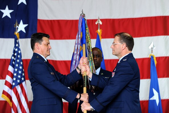 Maj. Gen. Frank Padilla (left), 10th Air Force commander, passes the guidon
to Col. Herman Brunke, 926th Group commander, during the group's change of
command ceremony May 29. Colonel Brunke takes command of the 926th GP after
being the Division Chief, Global Power Programs & Requirements, Headquarters
Air Force Reserve Command, Robins Air Force Base, Georgia. (Photo by Lawrence Crespo, 99th Air Base Wing public affairs)
