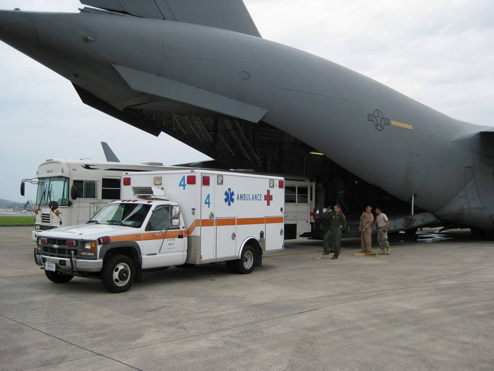 Two critically ill infants are loaded into a waiting C-17 Globemaster III May 26 for transport from Kadena Air Base, Japan, to Wilford Hall Medical Center at Lackland Air Force Base, Texas.  The combined efforts of the ECMO team from Wilford Hall's 59th Medical Wing; ground and aircrews from Kadena AB, Elmendorf and Eielson Air Force bases, Alaska; and Reserve support from the 433rd Airlift Wing at Lackland AFB, helped to ensure a successful mission to bring the ill infants to Wilford Hall for the advanced care that was unavailable at the U.S. Naval Hospital in Okinawa. (U.S. Air Force photo)