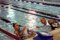 5/26/2009 - Air Force triathletes James Bales (left) and Anthony Milunas swim sets of 50-meter laps in preparation for the Armed Forces Triathlon at Naval Base Ventura County, Calif. (U.S. Air Force photo/Patrick Desmond)                                