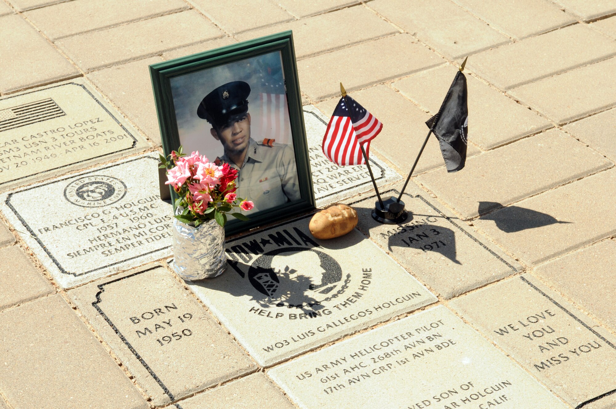 A display honoring Warrent Officer Luis Holguin, still missing from the Vietnam War, at the Vietnam Veterans Memorial at San Angelo Regional Airport Mathis Field May 25. (U.S. Air Force photo by Tech. Sgt. John Barton)