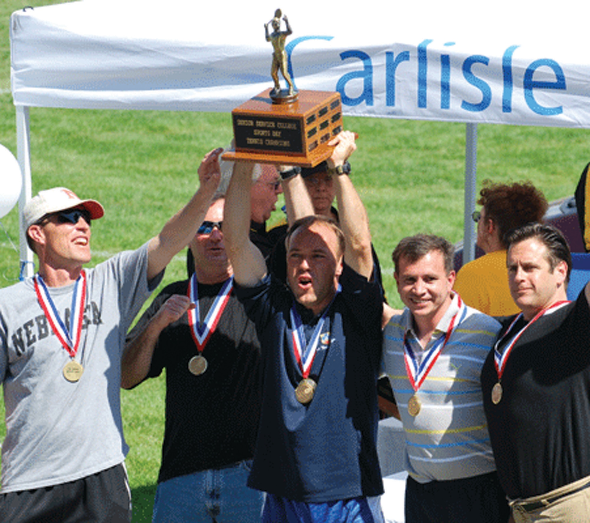 Taking first place at the Jim Thorpe Sports Days in tennis are (from left) Lt. Col. Jeffrey Hinrichs, Col. James "Keith" McKenzie, Lt. Col. Cedric "MC" Gaudilliere, Lt. Col. "Lalo" Ajuria-Benavides and Team Coach Dr. Gary Schaub. (Courtesy photo)