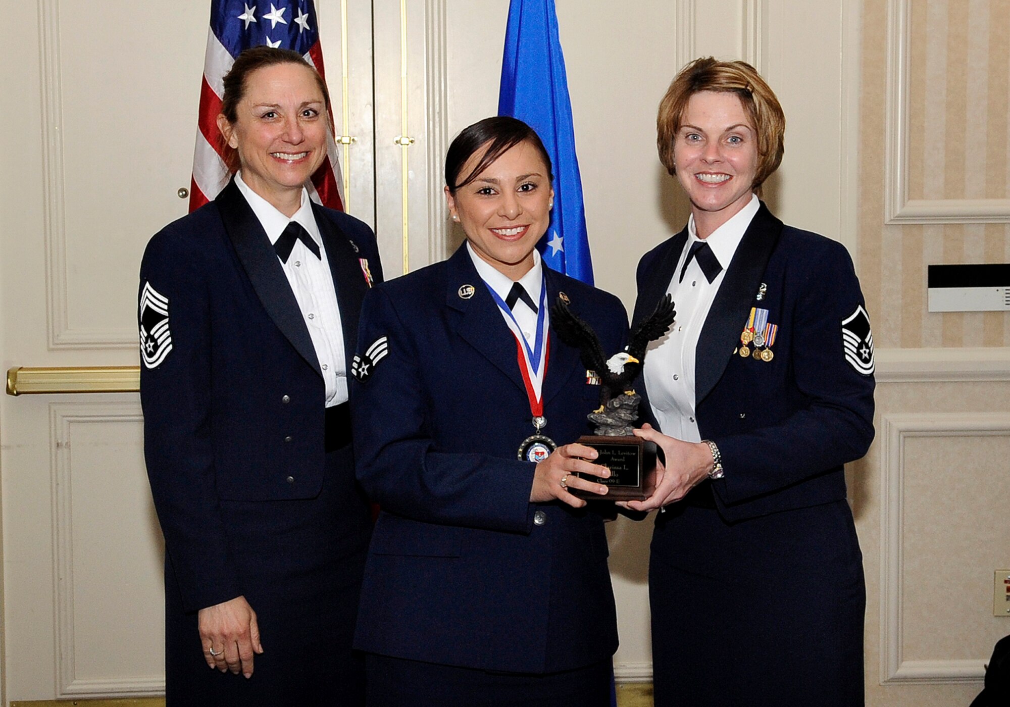 DENVER -- Senior Airman Clarissa Murillo, 566th Intelligence Squadron, seen here with the guest speaker, Chief Master Sgt. Valerie Pryor, Air Reserve Personnel Center, and Master Sgt. Jan Menard, 460th Medical Group, representing the Top 3 and presenting the John L. Levitow Award. The Airman Leadership School graduated 12 future Air Force non-commissioned officers at the Doubletree hotel here May 14. (U.S. Air Force photo by Senior Airman Steven Czyz)