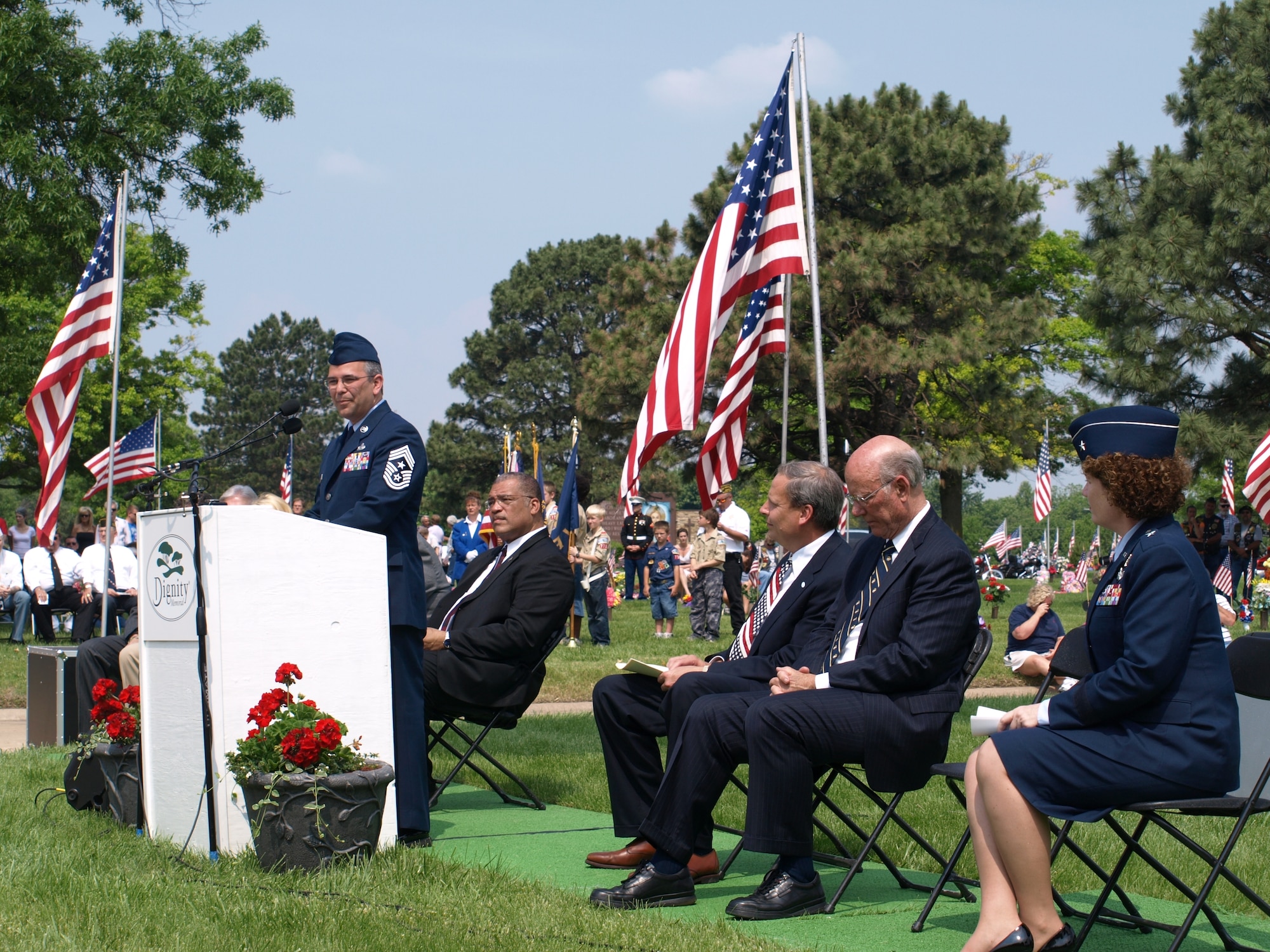 Chief Master Sgt. Timothy Horn, 22nd Air Refueling Wing command chief, addresses a crowd at the Resthaven Mortuary and Cemetery's Memorial Day service, May 25.  "Today is a solemn occasion," said Chief Horn.  "It is a time to reflect, a time to remind ourselves that the freedom we enjoy today comes at an enormous price." Hundreds of community members attended the event, while Chief Horn represented Team McConnell. (photo courtesy of Les Kline)

