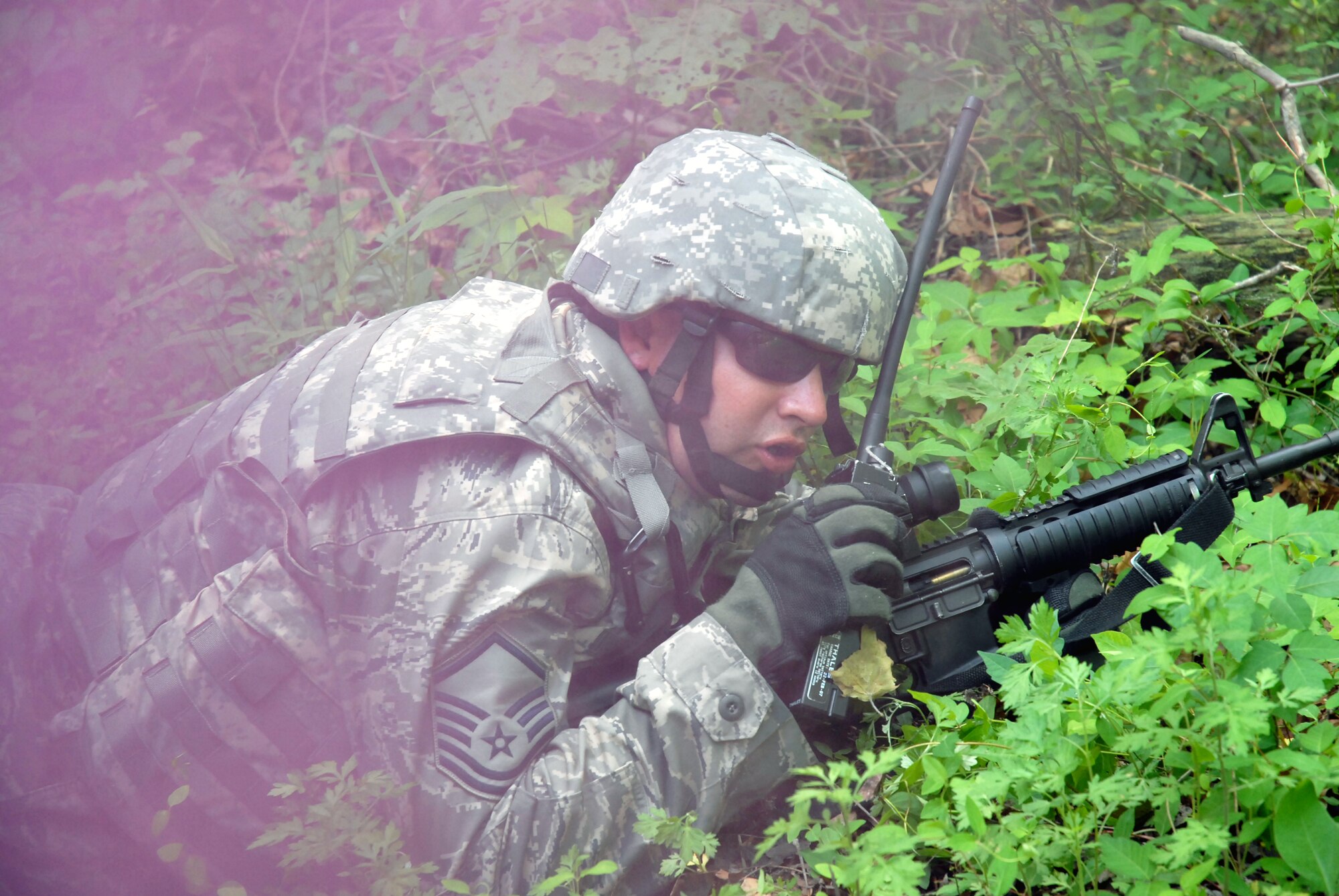 A student in the Air Force Phoenix Warrior Training Course calls for support during a training scenario for the course on May 25, 2009, on a Joint Base McGuire-Dix-Lakehurst, N.J., range.  Phoenix Warrior, taught by the U.S. Air Force Expeditionary Center's 421st Combat Training Squadron, prepares security forces Airmen for upcoming deployments.  (U.S. Air Force Photo/Staff Sgt. Paul R. Evans)