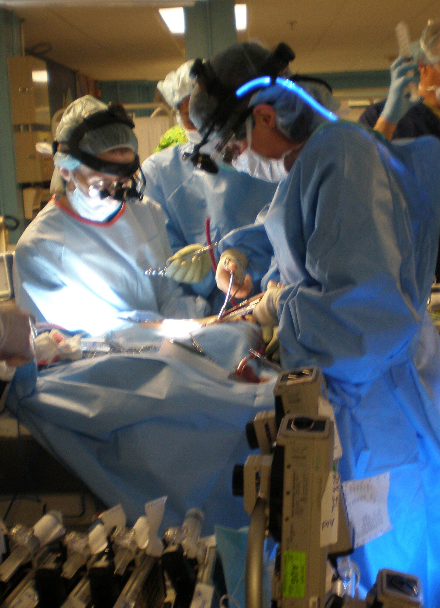 (Left to right) Dr. Mary Edwards, Tripler Army Medical Center pediatric surgeon, and Ford Brandon, Wilford Hall Medical Center extracorporeal membrane oxygenation coordinator, prepare a nine-month-old infant at U.S. Naval Hospital Okinawa, Japan, for a 15-hour flight to San Antonio, Texas, May 25.  A joint U.S. military team from several organizations helped move the infant, plus another, over the Memorial Day weekend to the continental United States for specialized care. (Courtesy photo)