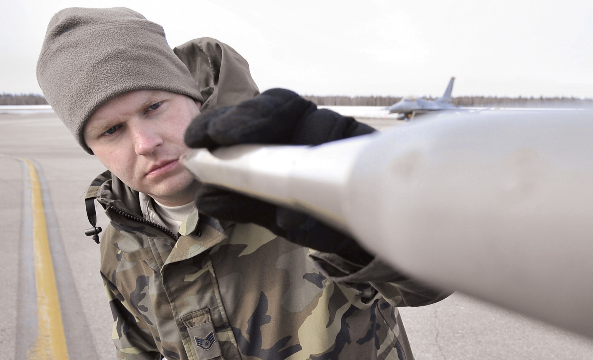 Staff Sgt. James George inspects a pitot tube on an F-16 Fighting Falcon for dents and debris April 17 during Red Flag-Alaska at Eielson Air Force Base, Alaska. Red Flag-Alaska is a Pacific Air Forces-directed field training exercise for U.S. and coalition forces who fly under simulated air-combat conditions. Sergeant George is a crew chief assigned to the Iowa Air National Guard's 132nd Fighter Wing from Des Moines.  (U.S. Air Force photo/Senior Airman Christopher Boitz) 