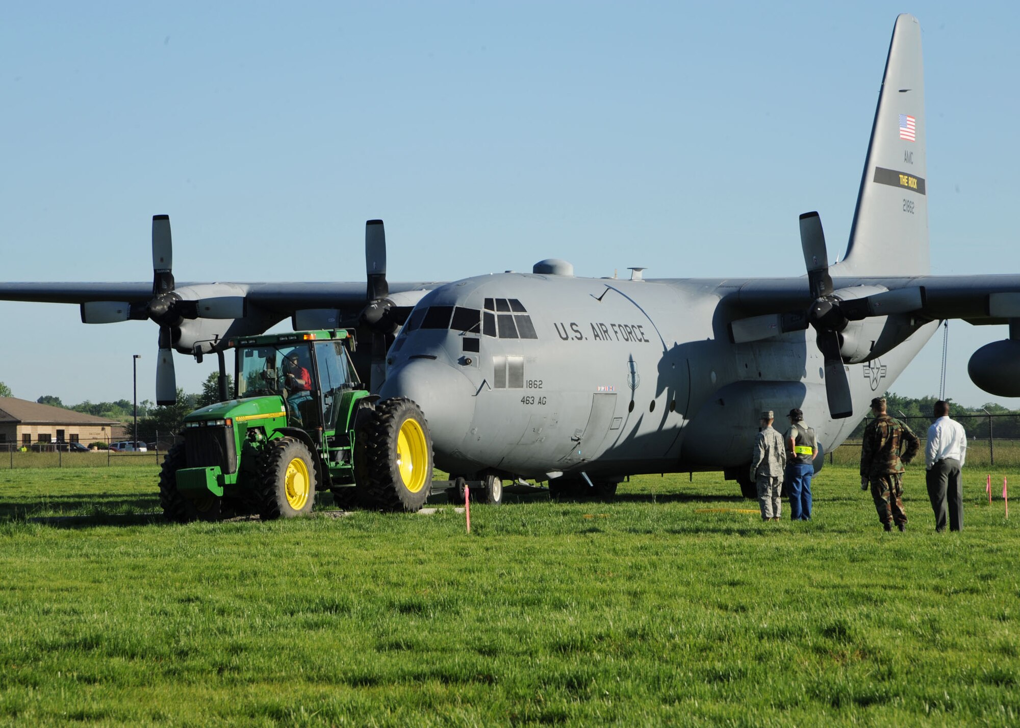 SCOTT AIR FORCE BASE, Ill. -- Paul Hayes, a civilian contractor with J.P. Burns Excavating, pulls the C-130E into position at Scott Field Heritage Airpark May 21.  The C-130E’s final flight was from Little Rock Air Force Base, Ark., to Scott May 12.  The plane is the fifth aircraft to be added to the airpark. (U.S. Air Force photo/Airman 1st Class Tristin English) 