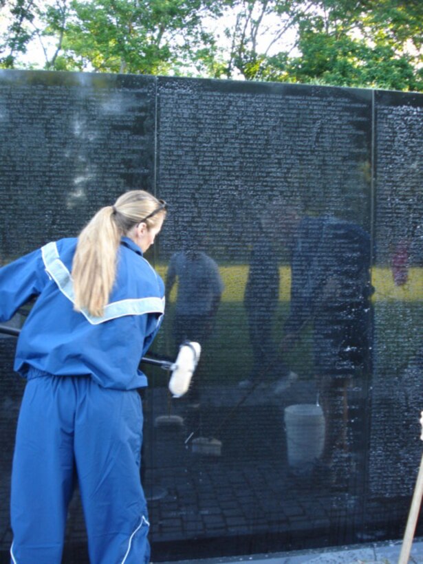 SEYMOUR JOHNSON AIR FORCE BASE, N.C. -- Senior Master Sgt. Dana Bates, a Reservist with the 916th Air Refueling Wing, washes the Vietnam Wall Memorial in Washington, D.C. in late May. Sgt. Bates was one of several members for the Air Force Sergeants Association Chapter 371 from Seymour Johnson that participated in cleaning the Vietnam and Korean memorials prior to Memorial Day.