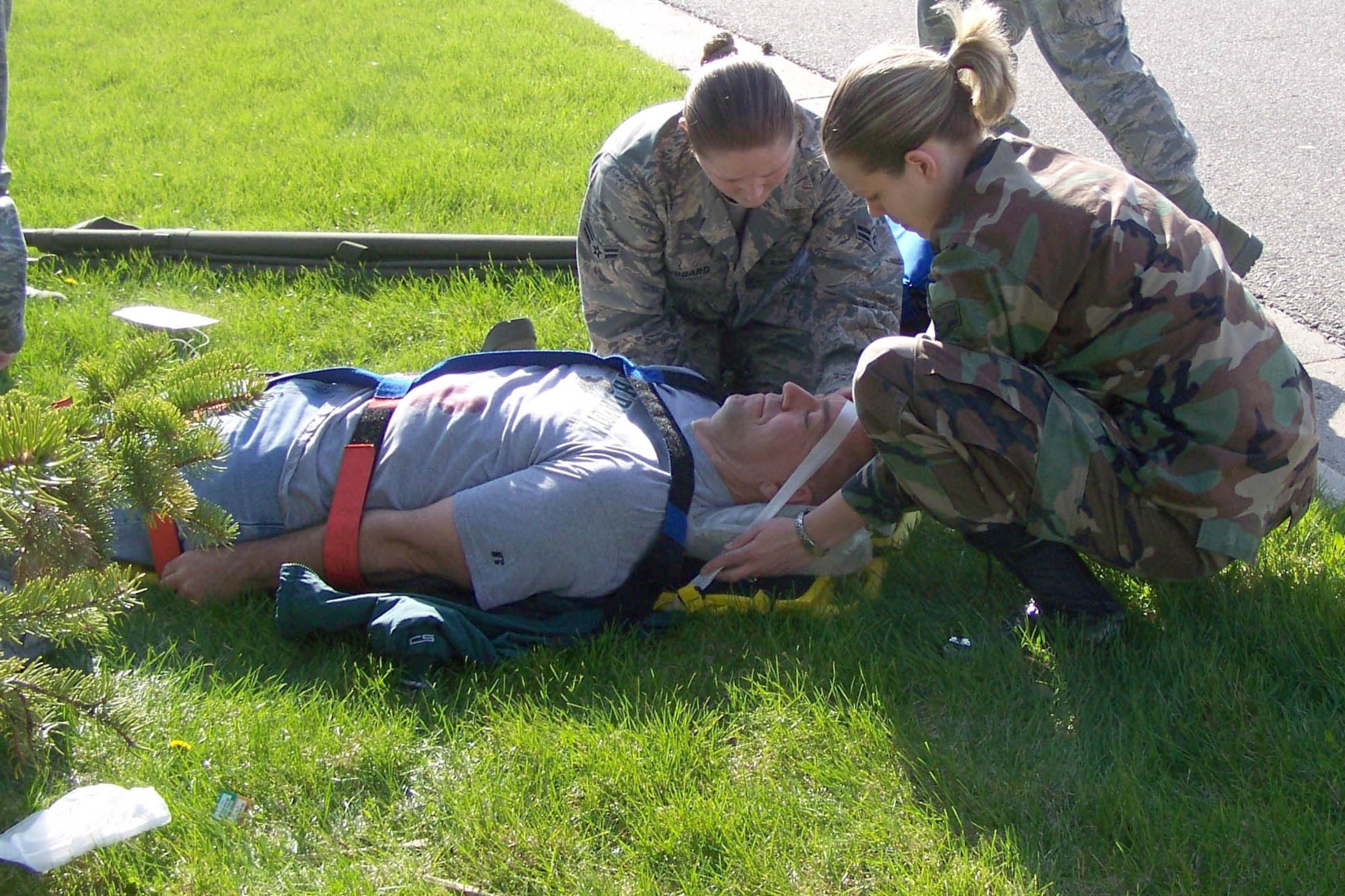 Airman 1st Class Carol Hubbard (left) and Senior Airman Jennifer Aviles, both from the 319th Medical Operations Squadron, care for their "patient" during a recent 319th Medical Group exercise. The exercise was designed to test medical personnel on their first response to multiple casualties. (U.S. Air Force photo/Senior Airman Jennifer Ferrizzi)


SrA Aviles Jennifer.Aviles
A1C Hubbard carol.hubbard
