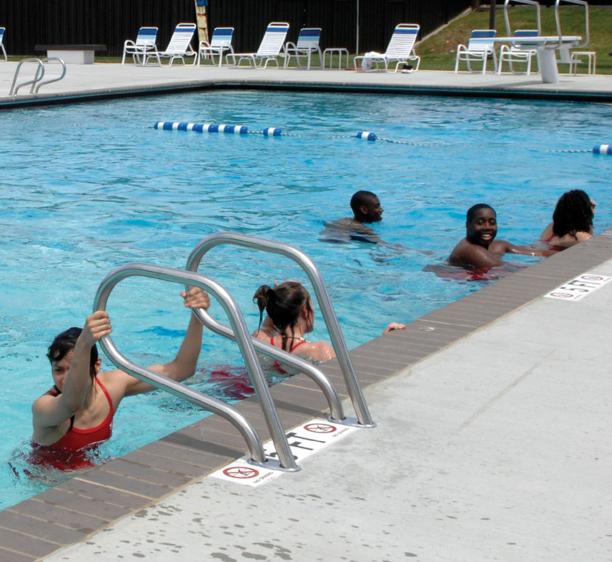 Andrews lifeguards finish an initial lap across the base pool, marking the official opening of the Gateway Pool May 22. Pool access is free this year to all Team Andrews members. (U.S. Air Force photo/ Staff Sgt. Melissa Stonecipher)