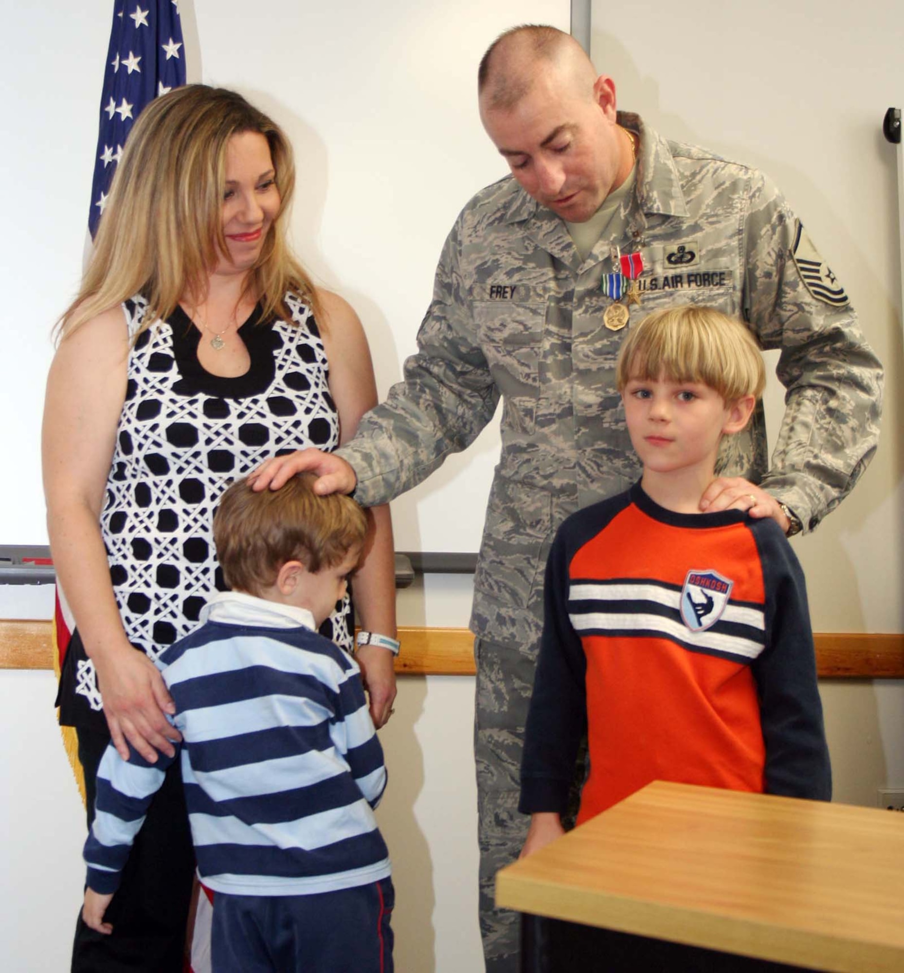 Master Sgt. Duane Frey, 65th CONS, was accompanied to the presentation ceremony by his wife, Patrizia and two children, Joseph and Tommy.  Sergeant Frey said he was humbled to receive these medals, but most importantly expressed his desire to share the honor with his wife and children and those members of Lajes who provided support to them (his family) during his absence.  (U.S. Air Force photo by Staff Sgt. Olufemi Owolabi)