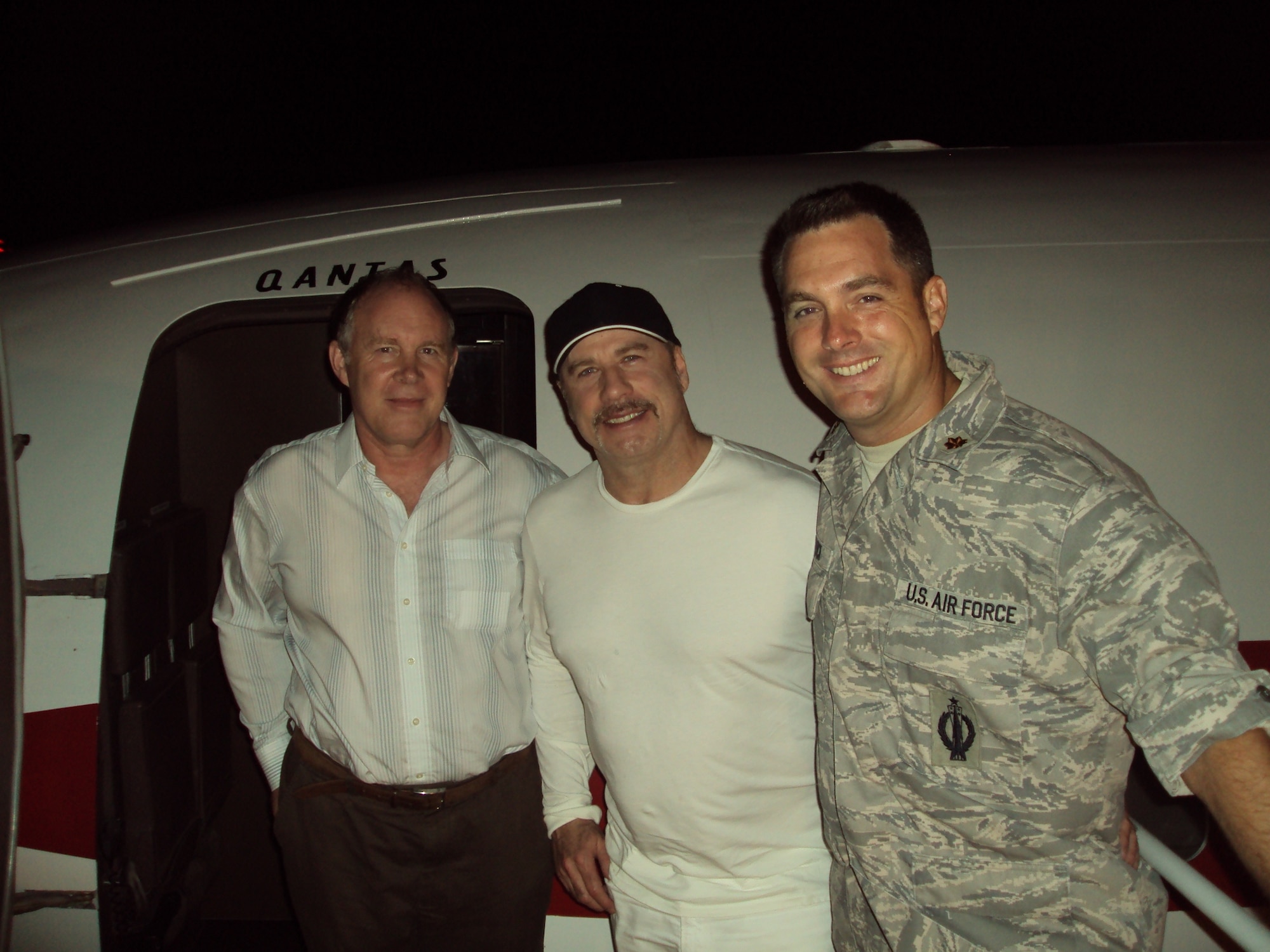 John Travolta (center) poses for a picture with Ascension Island Air Field Commander Maj. Jay Block (right) and Island Administrator Ross Denny during the actor's brief visit to Ascension May 21. Mr. Travolta landed on the island to refuel his plane following a vacation in Africa and was given a tour of the base and the rest of the island. “He thanked us for our service, asked a lot of questions about our mission and the island,” said Major Block of Mr. Travolta. “He was a really engaging and very friendly person.”
(U.S. Air Force photo courtesy Maj. Jay Block)