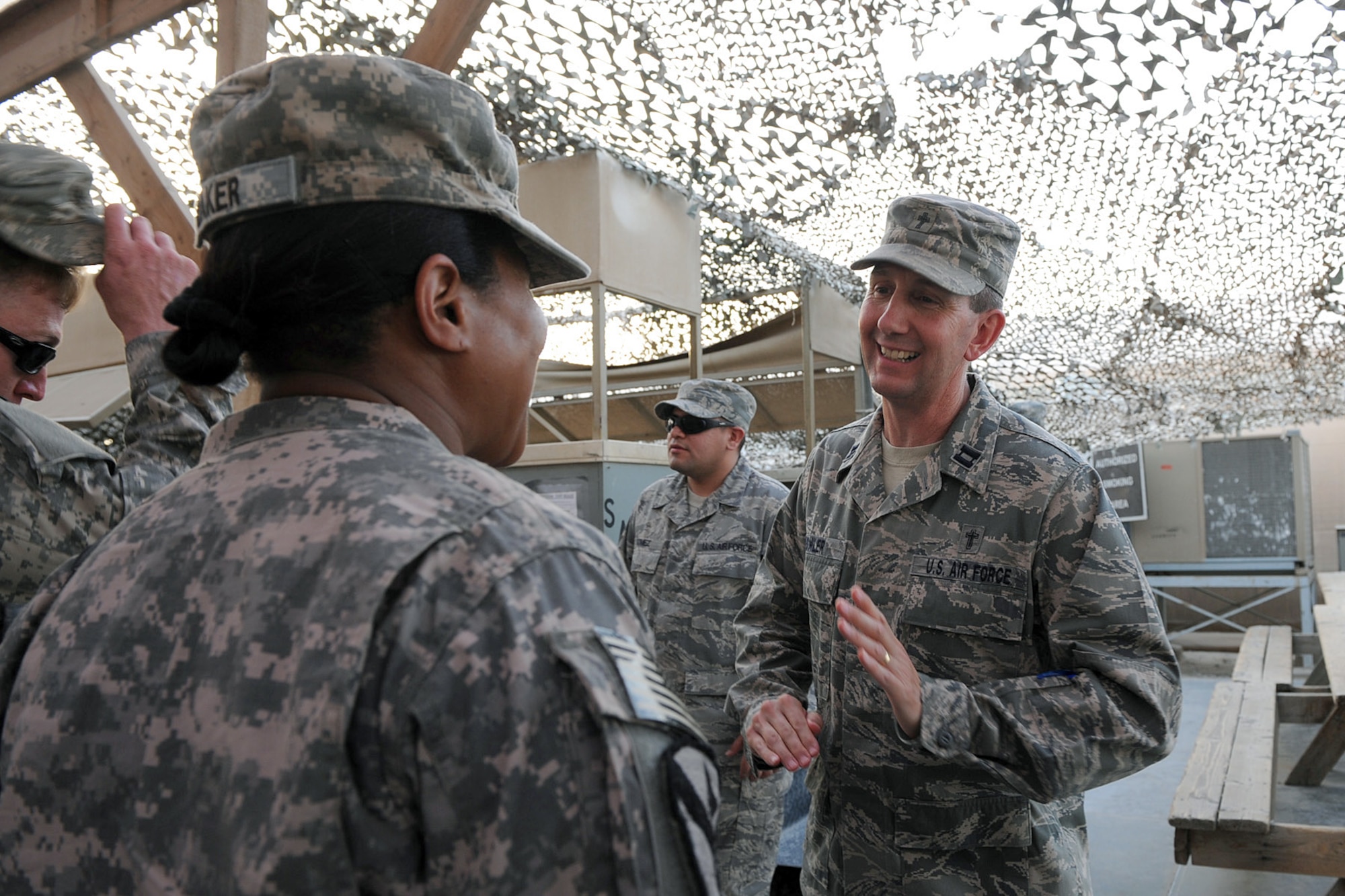 SOUTHWEST ASIA -- Chaplain (Capt.) Larry Fowler, 586th Air Expeditionary Group,talks to service members before they depart from the Navy Customs Facility back to the United States on Rest and Relaxation Leave from a base in the Middle East, May 27. Chaplain Fowler discusses with service members about taking the time to relax and enjoy the time home with their families. After the Chaplain gives his blessings, the service members take close to a two day trip before finally getting to see their families again. (U.S. Navy photo by Navy Petty Officer 2nd Class Jorge Saucedo)