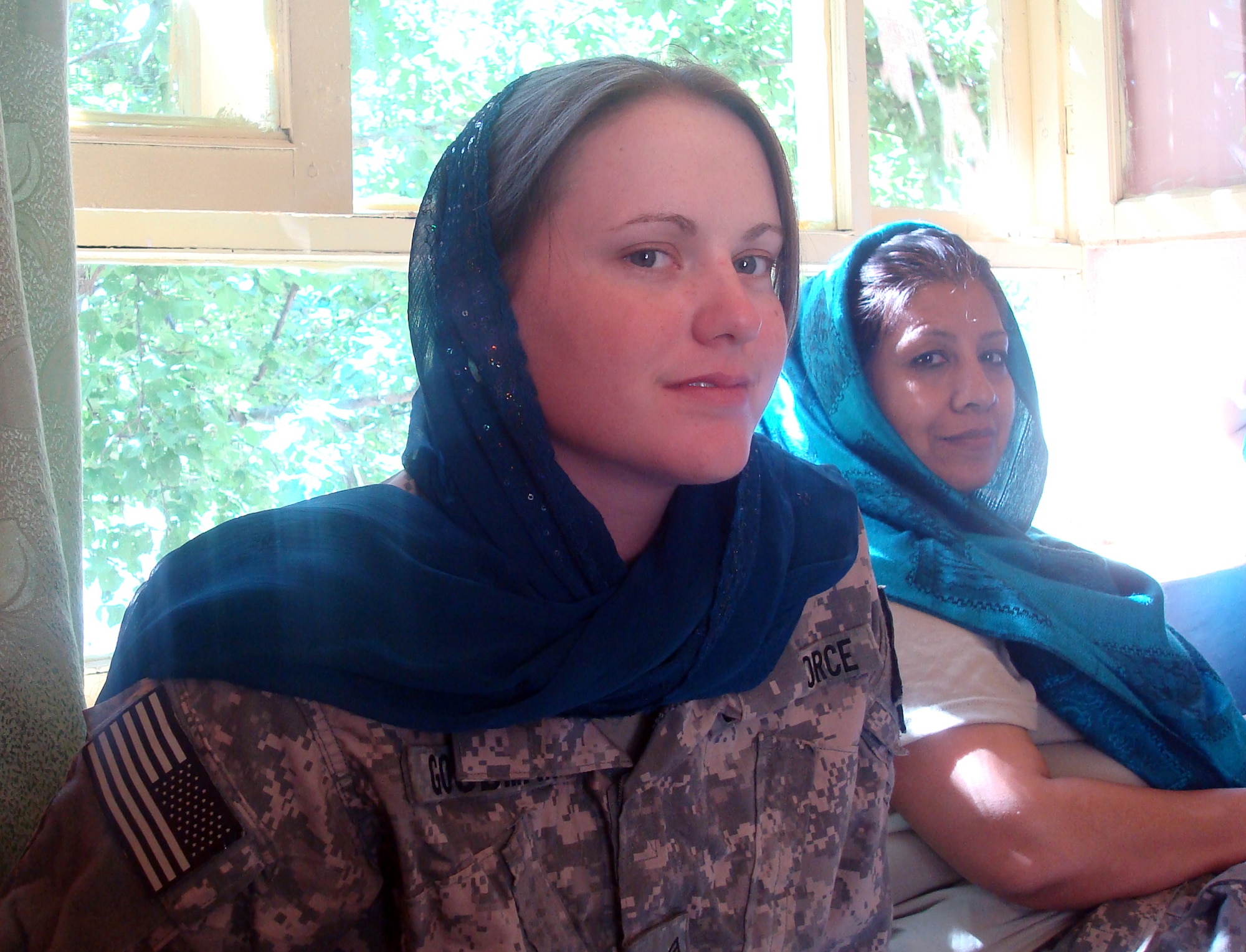 Senior Airman Ashton Goodman was instrumental in advancing women's affairs in Afghanistan's Panjshir Province. On May 23, she participated in a shura, or meeting, with the Afghan Director of Women's Affairs and 20 local women and teenage girls. The group discussed future educational opportunities for the valley's women and girls. Airman Goodman lost her life May 26 from wounds sustained from an improvised explosive device. (U.S. Air Force photo by Capt. Stacie N. Shafran)