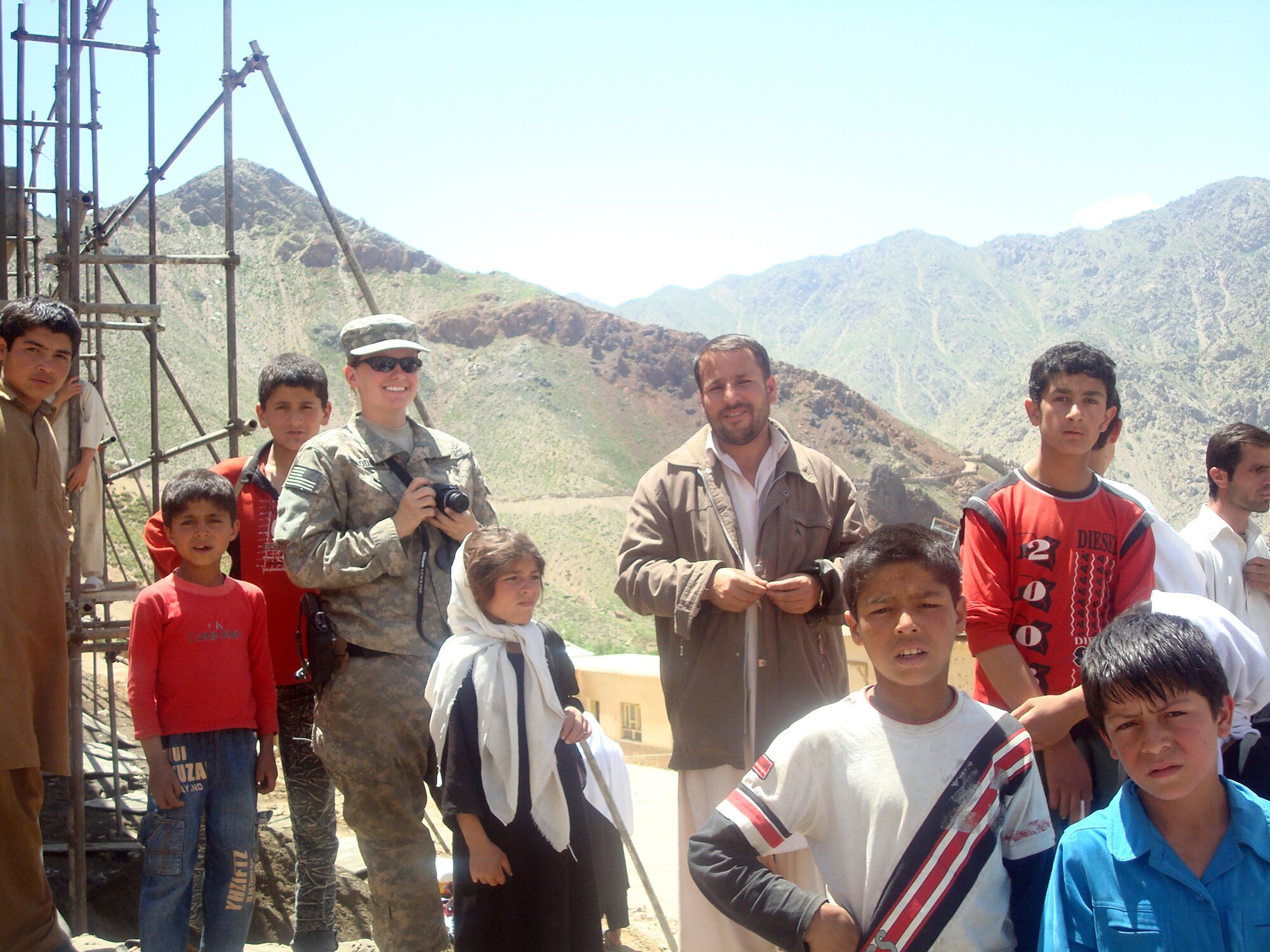 Senior Airman Ashton Goodman organized a humanitarian assistance mission for more than 100 poor Afghan women in a nearby village May 18, 2009. An aspiring writer and photographer, Airmen Goodman enjoyed capturing the Panjshir Provincial Reconstruction Team's mission in photos and words. She also enjoyed the cultural diversity of this deployment and interaction with the Panjshir people. Airman Goodman lost her life May 26 from wounds sustained from an improvised explosive device. (U.S. Air Force photo by Capt. Stacie N. Shafran)
                               