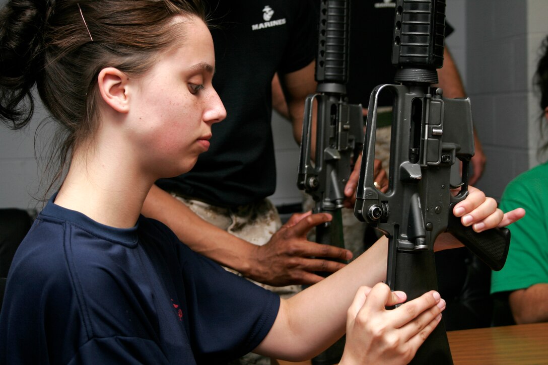 Sara Voss practices locking the M-16A2 bolt to the rear during a weapons class at a female pool function March 30 at the U.S. Marine Corps Reserve Center in Madison, Wis. Recruiting Station Milwaukee recruiters hope a new focus on female-only functions will lower its female pool attrition rate, which is currently at 26 percent. Voss is a poolee at Recruiting Substation Green Bay, Wis.