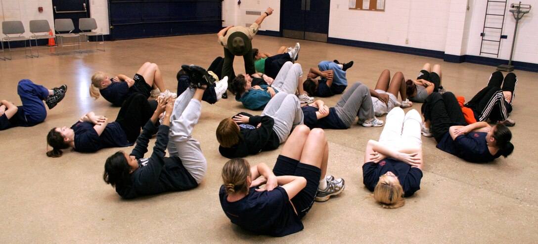 Drill Instructor Sgt. Maria Arellano gives Wisconsin Marine-hopefuls a taste of boot camp during a female pool function March 30 at the U.S. Marine Corps Reserve Center in Madison, Wis. Recruiting Station Milwaukee recruiters hope a new focus on female-only functions will lower its female pool attrition rate, which is currently at 26 percent. Arellano is a drill instructor at Marine Corps Recruit Depot Parris Island, S.C.
