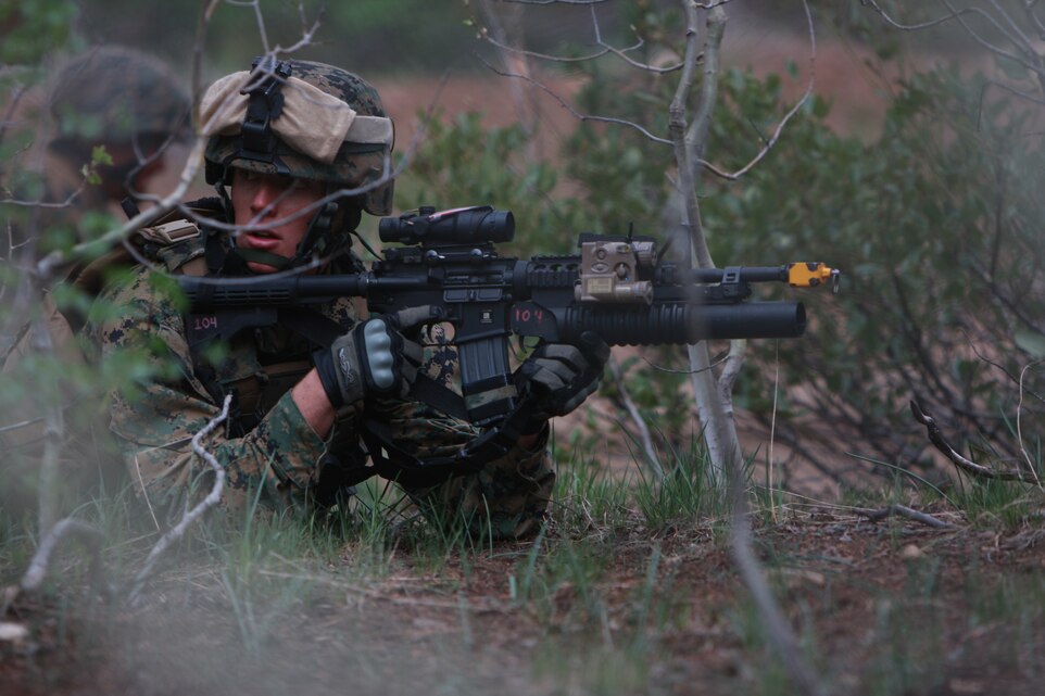 Cpl. Paul Tyler, a rifleman with Embedded Training Team 7–5, listens to commands from his squad May 31 during the team’s training at Mountain Warfare Training Center Bridgeport, Calif.