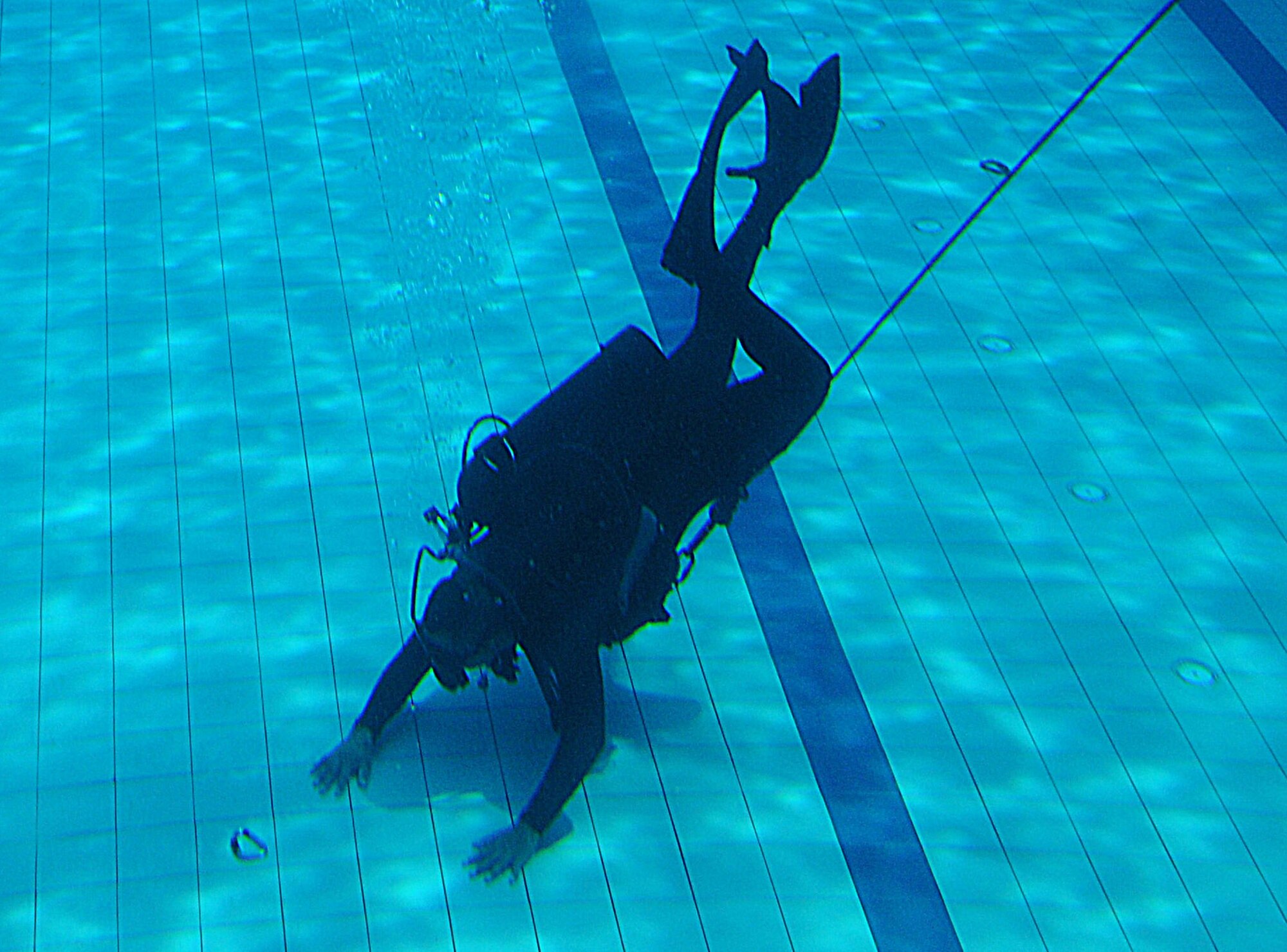 ON A MILTARY INSTALLATION IN MALAYSIA -- A Paskau member of the Royal Malaysian Air Force attempts to recover an item during an underwater search and recovery course here May 28 as part of Teak Mint 09-1. The Paskau is the special operations branch of the Royal Malaysian Air Force. Teak Mint 09-1 is a training exchange designed to enhance U.S and Malaysian military training and capabilities. (Photo by Tech. Sgt. Aaron Cram)