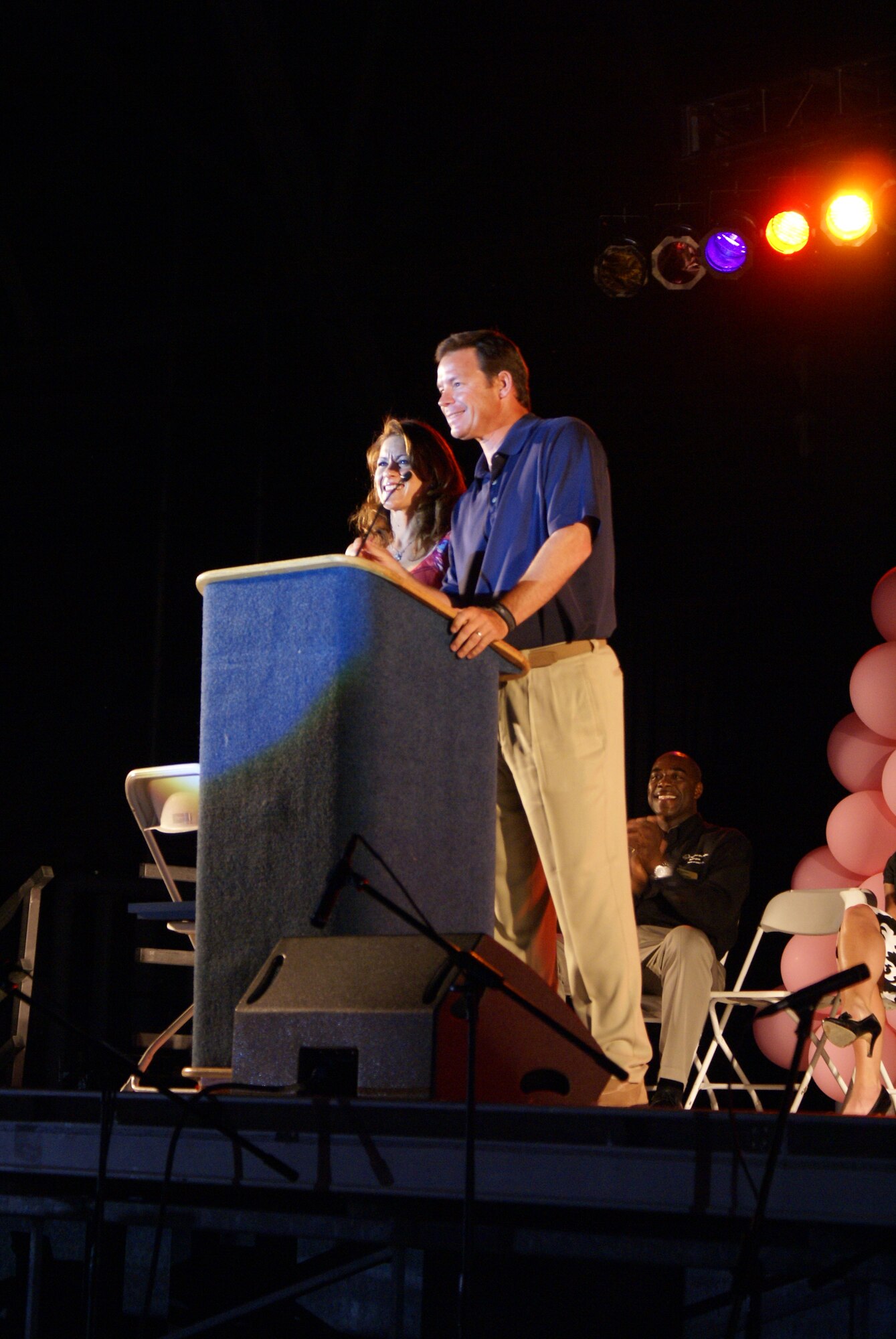 Seattle Seahawks head coach Jim Mora, and his wife, Shannon, welcome athletes, athletes, their families and volunteers to opening ceremonies of the annual Special Olympics Washington Summer Games here May 29. McChord and Fort Lewis are teamed up to host more than 8,000 athletes, coaches and volunteers participating in the annual Summer Games. Events including aquatics, athletics (field events), cycling, power lifting, and soccer are part of this year's competition. (U.S. Air Force photo/Staff Sgt. Eric Burks)
