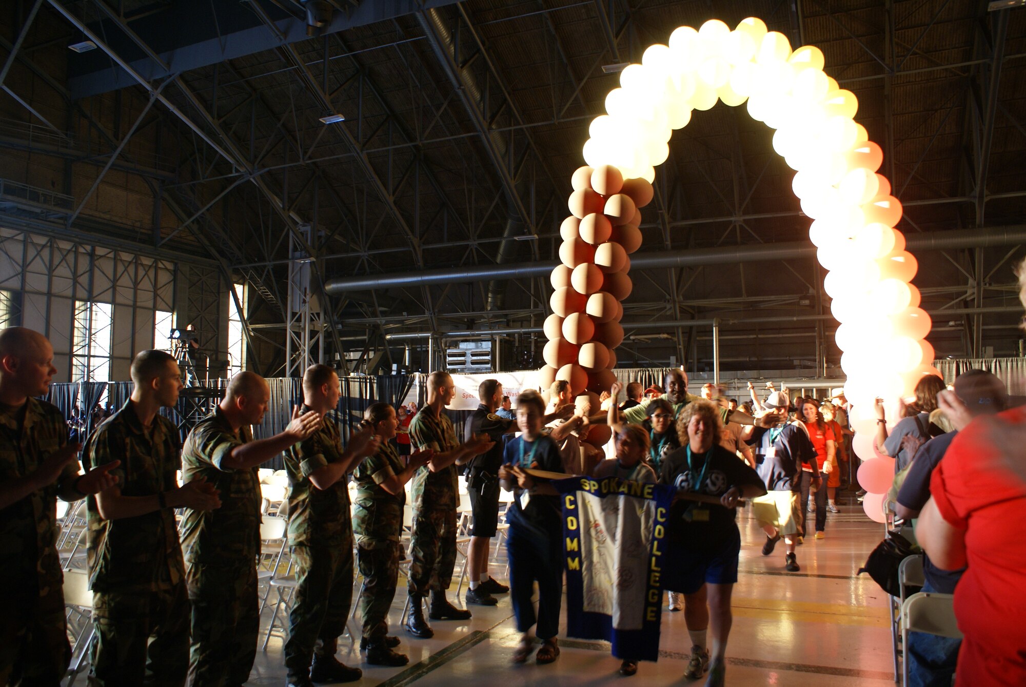 Athletes, their families and volunteers arrive for opening ceremonies of the annual Special Olympics Washington Summer Games here May 29. McChord and Fort Lewis are teamed up to host more than 8,000 athletes, coaches and volunteers participating in the annual Summer Games. Events including aquatics, athletics (field events), cycling, power lifting, and soccer are part of this year's competition. (U.S. Air Force photo/Staff Sgt. Eric Burks)