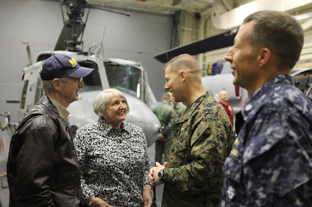 Gordon England, former Secretary of the Navy; Dotty England, sponsor of USS New York; Col. Mark J. Desens, commanding officer of Special Purpose Marine Air Ground Task Force 26 and Cmdr. F. Curtis Jones, commander of USS New York, greet one another aboard USS New York, Nov. 1, 2009, off the coast of New York. The Englands, along with approximately 100 other guests, were given a tour of the ship that included exhibits containing Marine Corps equipment and vehicles. Manning each display were Marines from SPMAGTF-26, which was formed by North Carolina Marines from several units to support the ship’s commissioning in New York City, Nov. 7. (Official USMC photo by Lance Cpl. Tommy Bellegarde) (Released)