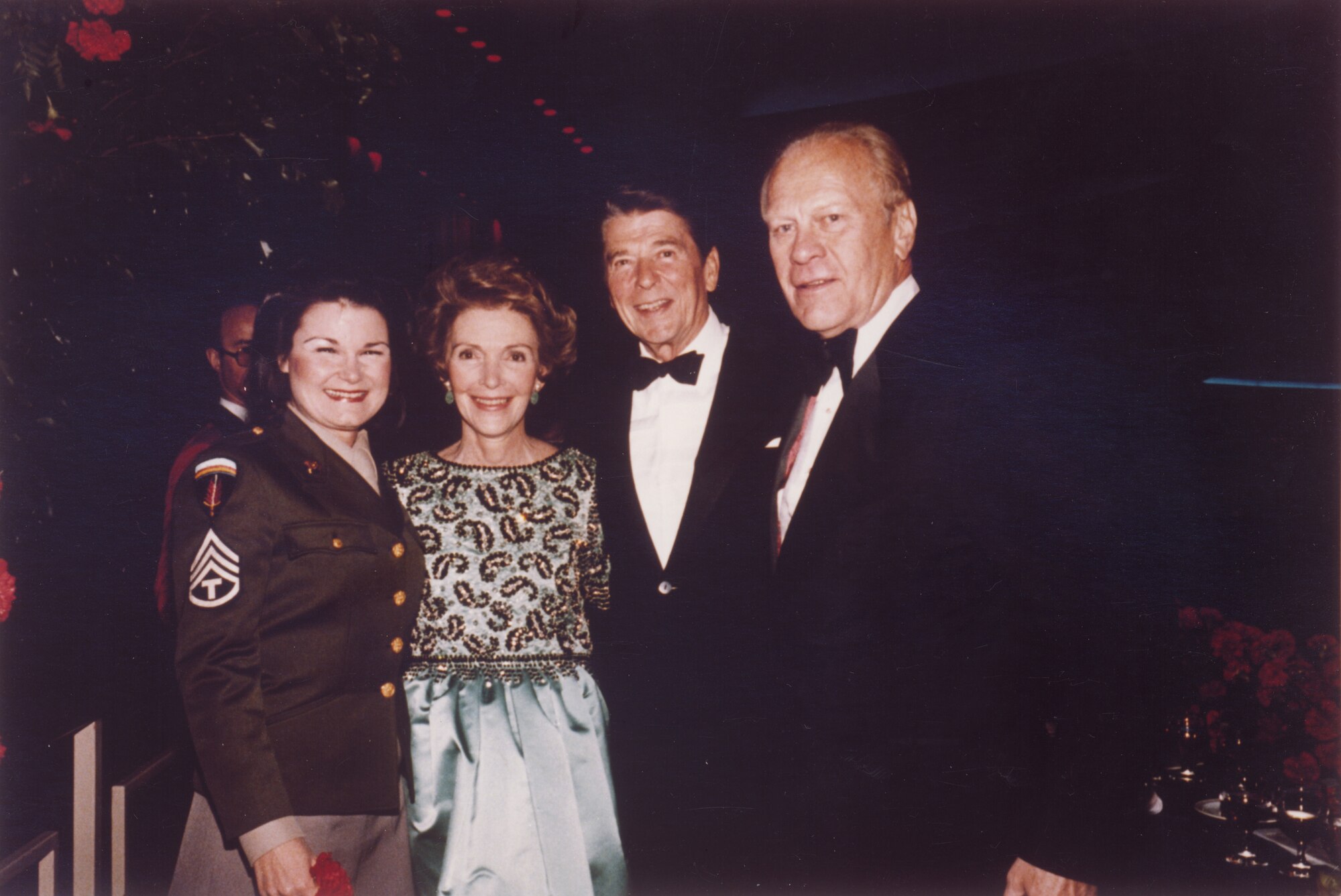 Vocalist SMSgt (Ret.) Bobbie Coonin, USAF Band, with President and Mrs. Reagan, and Former President Gerald Ford at the 40th Anniversary of the USO, October 17, 1981, in the International Ballroom of the Washington Hilton Hotel.  This is Photo 19. (Photographer Unknown)