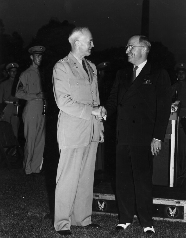 President Harry S. Truman and General Henry “Hap” Arnold on the White House lawn.  We are looking to identify the other individuals in the photo and any behind-the-scenes stories from this event.  Please email our Band Historian <a href="mailto:usafbandhistorian@afncr.af.mil">Technical Sgt. Tracey MacDonald</a>. Thank you and we look forward to hearing from you!  This is Photo 17. (Unknown Photo)