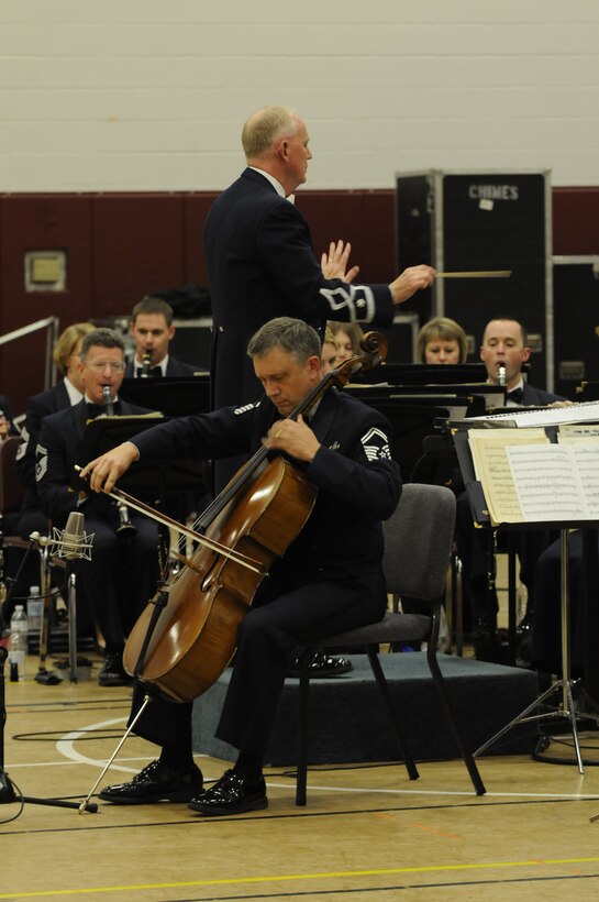 Senior Master Sgt. Chris Moehlenkamp performs Camille Saint-Saens' "Cello Concerto in A minor."  Sgt. Moehlenkamp, a native of Lynchburg, Va., was chosen to perform as a soloist for the fall 2009 tour. The Concert Band performed many standards and transcriptions, such as Aaron Copland’s "An Outdoor Overture" and Modest Mussorgsky’s "Pictures at an Exhibition."  More modern works, such as John Adams’ "A Short Ride in a Fast Machine" and Ronald Foster’s "Aurora Borealis," were also featured. (Photo by SrA Tim Chacon)