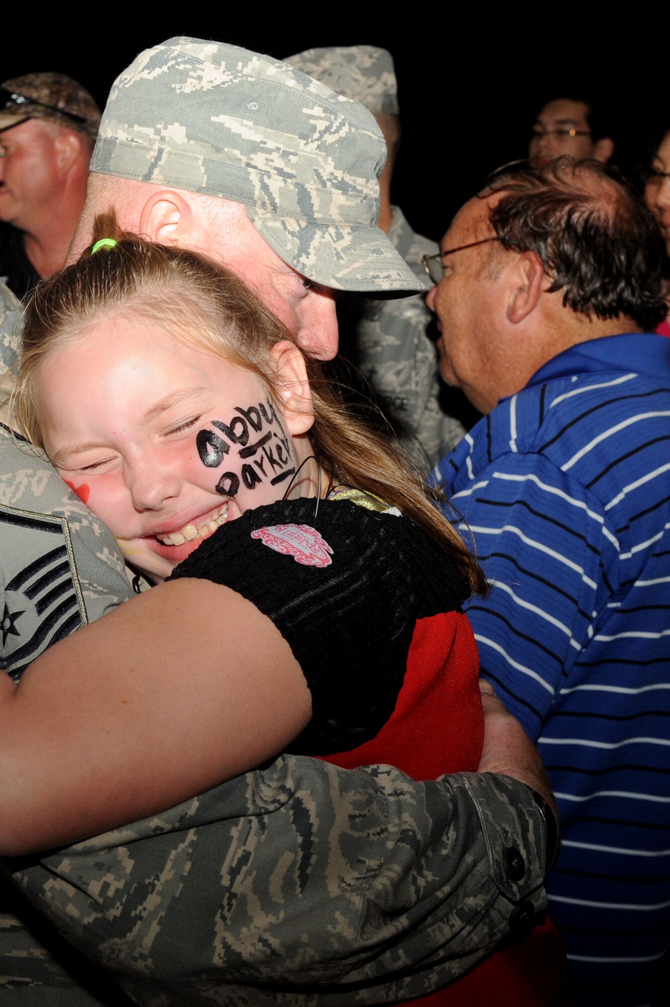SHAW AIR FORCE BASE, S.C. -- Master Sgt. Joseph Parker, 20th Security Forces Squadron, is greeted by his daughter Oct. 31, after spending more than six months deployed in Afghanistan. About 30 Airmen from Shaw’s 20th SFS returned from deployment. (U.S. Air Force Photo/Senior Airman David Minor)
