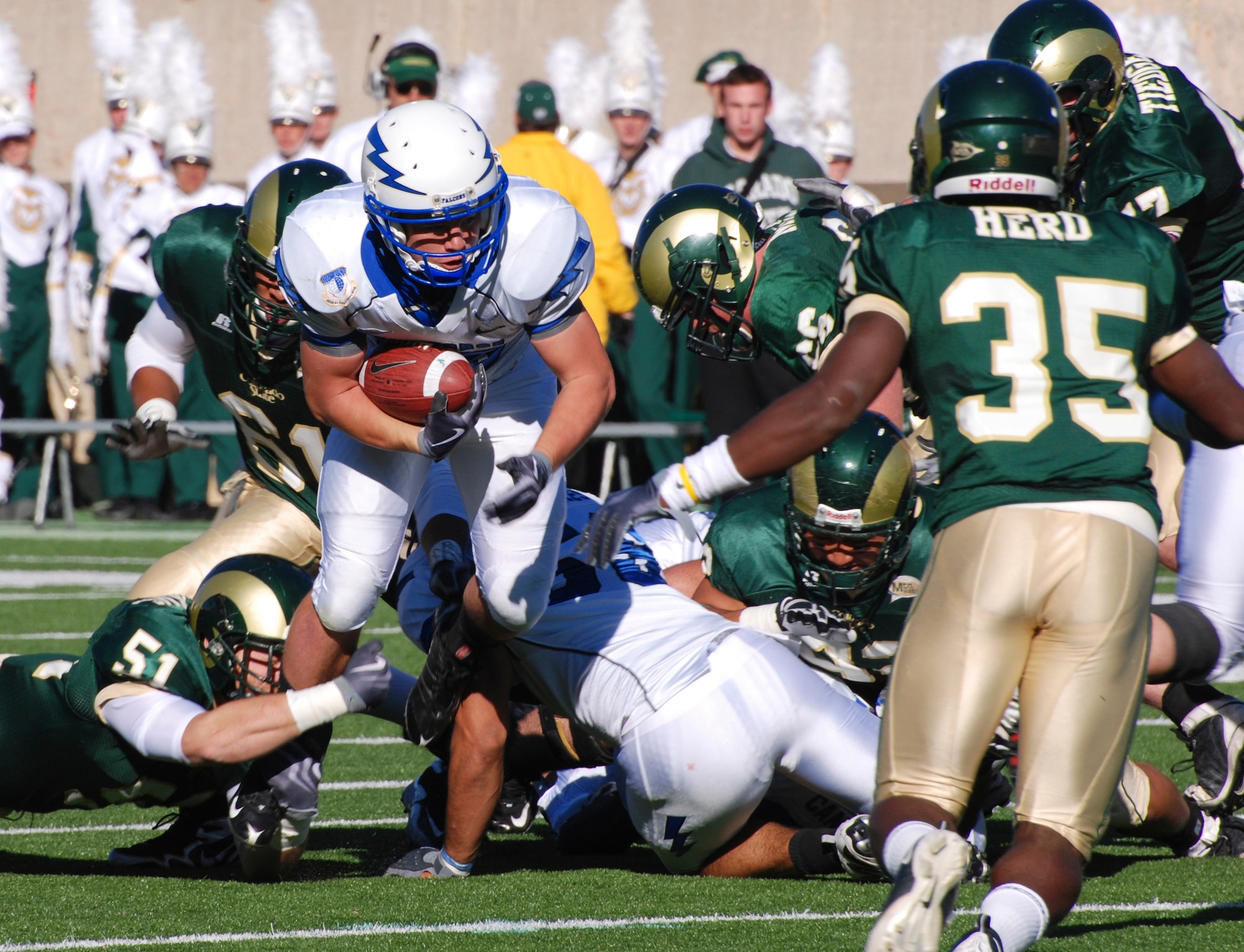 Falcons fullback Jared Tew bulls his way through the CSU defense for a gain. Tew was a mainstay of the Air Force Academy rushing game, carrying the ball for 20 of the Falcons' 59 rushing attempts, in a 34-16 win over CSU Oct. 31, 2009. (U.S. Air Force photo/Denise Navoy)
