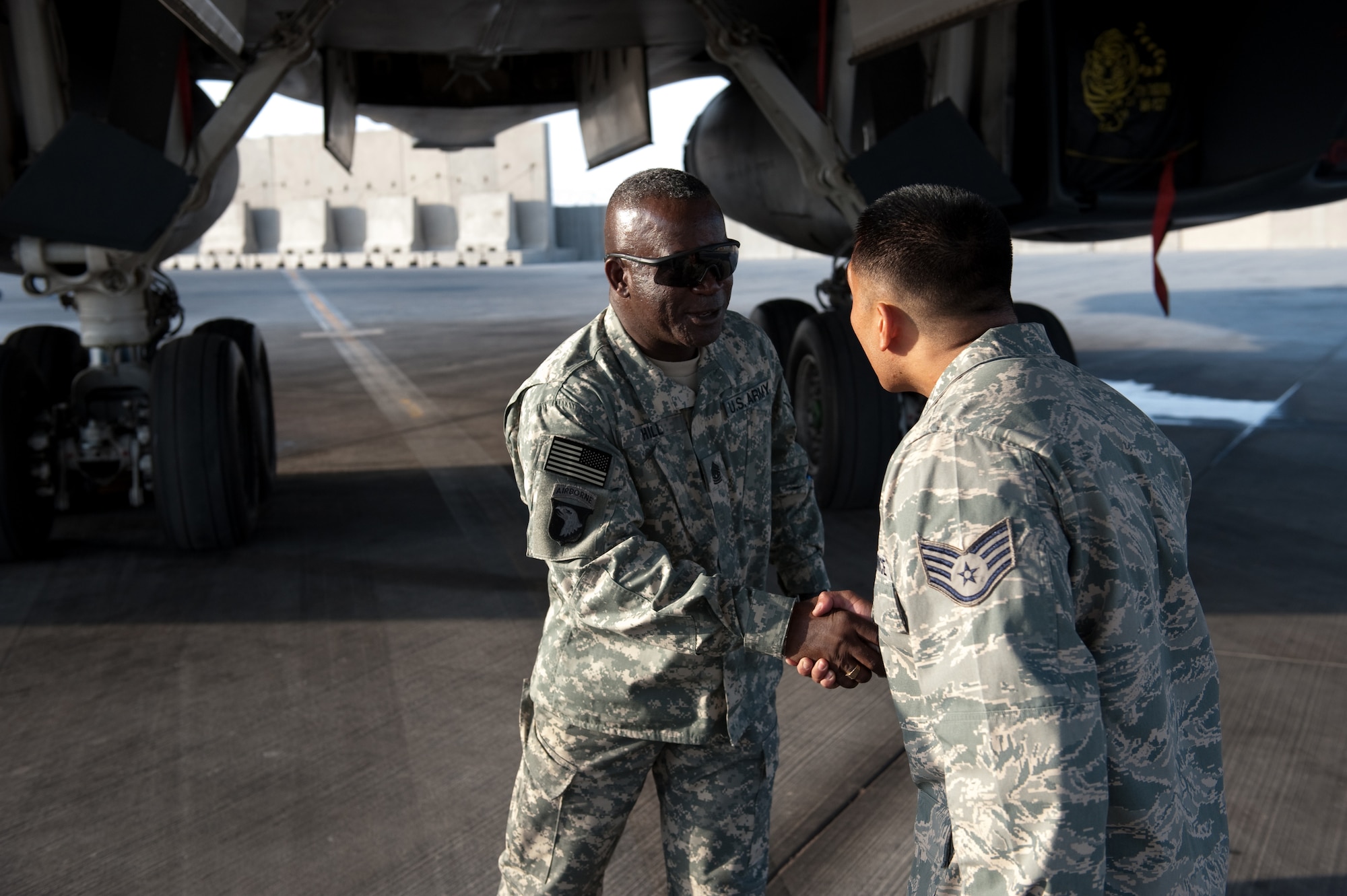 Command Sergeant Major Marvin Hill, command senior enlisted leader of U.S. Central Command, visits with Staff Sgt. Walterio Nogra, a B-1B Lancer crew chief, Oct. 28, 2009, in Southwest Asia. Command Sergeant Major Hill toured 379 AEW facilities as part of a USCENTCOM trip throughout Southwest Asia. (U.S. Air Force photo/Staff Sgt. Robert Barney) 