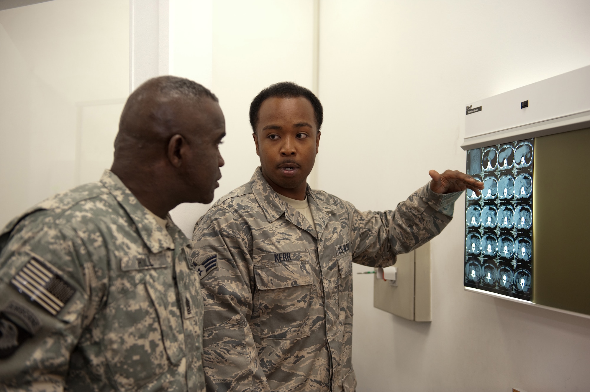 Command Sergeant Major Marvin Hill, command senior enlisted leader of U.S. Central Command, gets an overview of the 379th Expeditionary Medical Group's radiological section from Senior Airman Kenneth Kerr, Oct. 28, 2009, in Southwest Asia. Command Sergeant Major Hill toured 379 AEW facilities as part of a USCENTCOM trip throughout Southwest Asia. (U.S. Air Force photo/Staff Sgt. Robert Barney) 