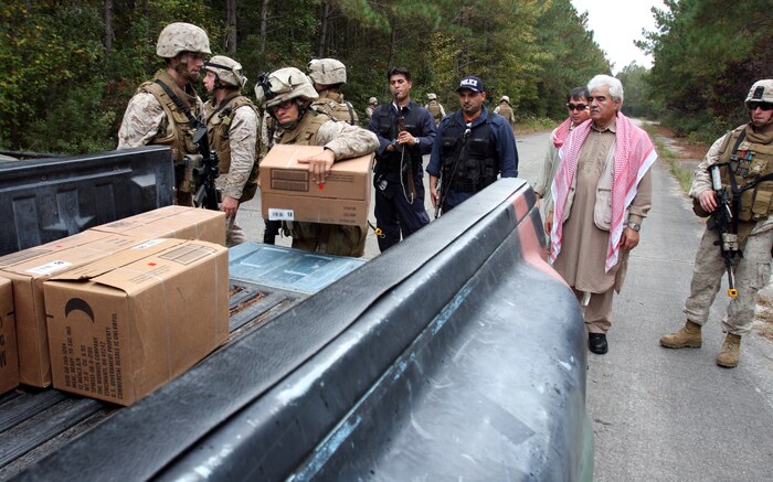 Marines from Combined Anti-Armor Team Platoon, Weapons Company, Battalion Landing Team 1st Battalion, 6th Marine Regiment, 24th Marine Expeditionary Unit, load boxes of relief supplies for local national officials at an entry control point during a Humanitarian Assistance exercise Nov. 1 as part of the 24th MEU’s Composite Unit Training Exercise.  The HA exercise tested the 24th MEU’s ability to operate as the landing force of the Nassau Amphibious Ready Group for its upcoming deployment.  (U.S. Marine Corps photo by Cpl. Alex C. Guerra)
