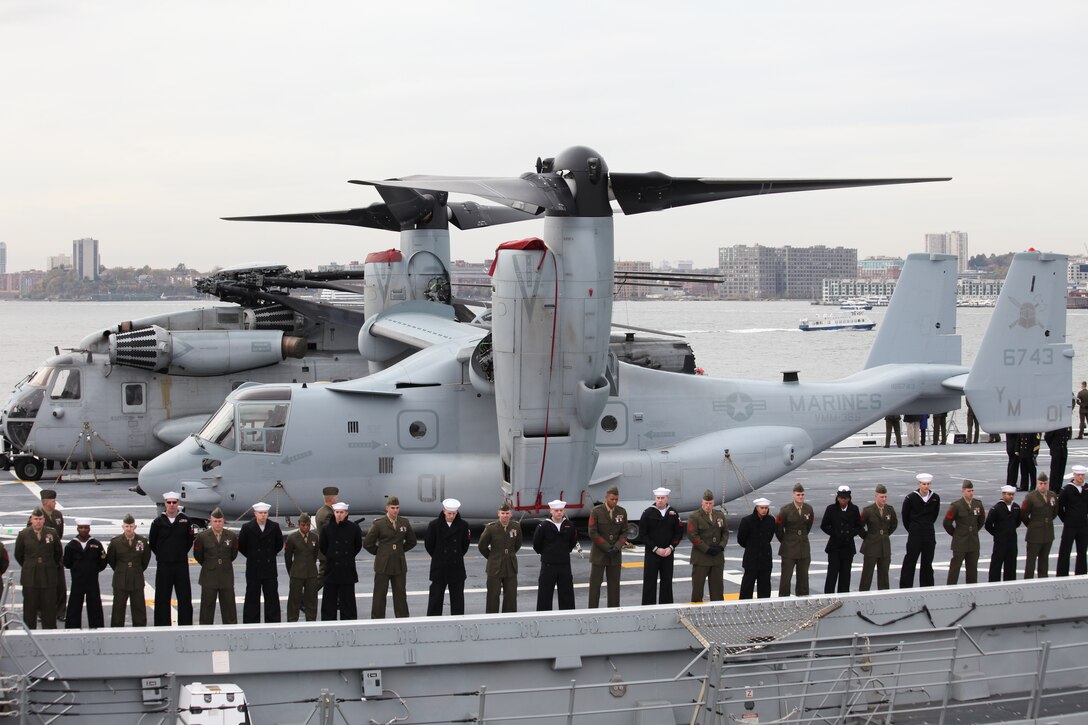 Marines from the Special Purpose Marine Air Ground Task Force 26 and sailors from the USS New York man the rails of the USS New York Nov. 2, 2009. Marines from several units that merged to form Special Purpose Marine Air Ground Task Force 26 to support the ship's commissioning in New York City, Nov. 7.