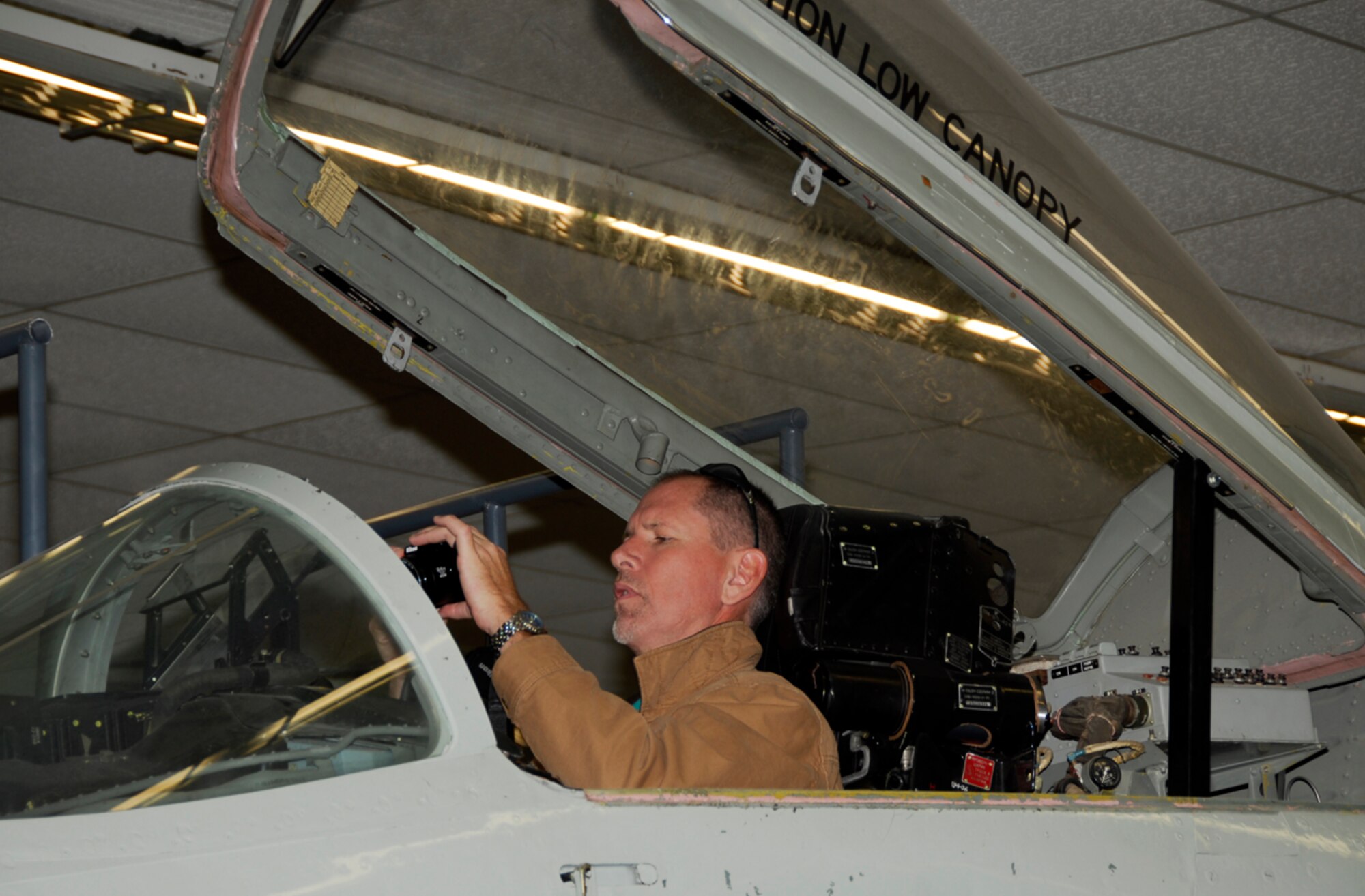 An employee of the Federal Aviation Administration (FAA) sits in the cockpit of a MIG-29 during a guided tour of the 547th Intelligence Squadron's Threat Systems Area, informally dubbed "The Petting Zoo," at Nellis Air Force Base, Nev., Oct. 15 during a civic tour to the base. The primary objective was to observe the 188th's deployment preparations for the unit's upcoming Aerospace Expeditionary Force (AEF) rotation in Afghanistan in spring 2010. (U.S. Air Force photo by Senior Master Sgt. Dennis Brambl/188th Fighter Wing Public Affairs) 
